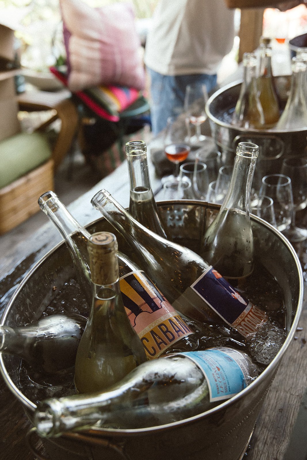 An ice bucket filled with bottles of wine