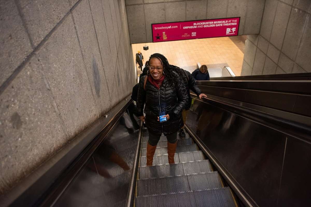  Lateefah Simon, BART's new board president and a single mom who is legally blind, taking the escalator to the train platform at the Richmond BART station during her morning commute on January 16, 2020 in Richmond, Calif. 