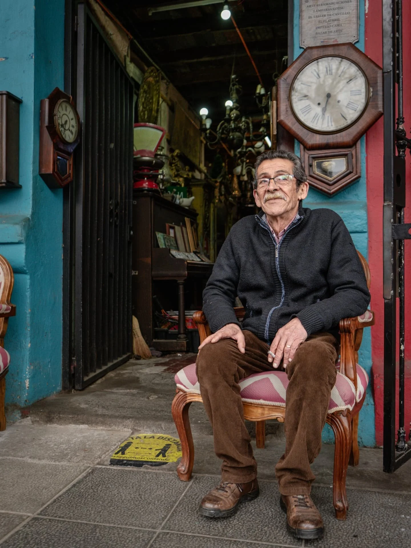 Somewhere in the streets of Santiago, Chile. 🇨🇱

Men scatter across the block, refurbishing old furniture. An orange street cat rests on what he&rsquo;s deemed his throne. Tight nooks spill over with antiques older than me. A fine gentleman, cigare