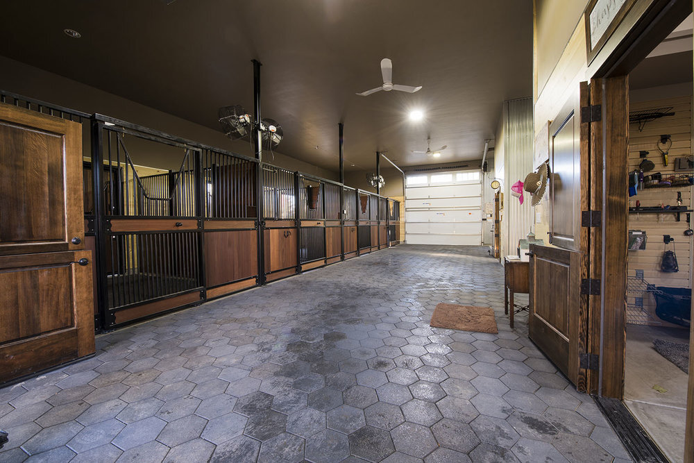  Rubber tiles, wood slatted stalls and iron trim make Franny's barn durable and beautiful. 