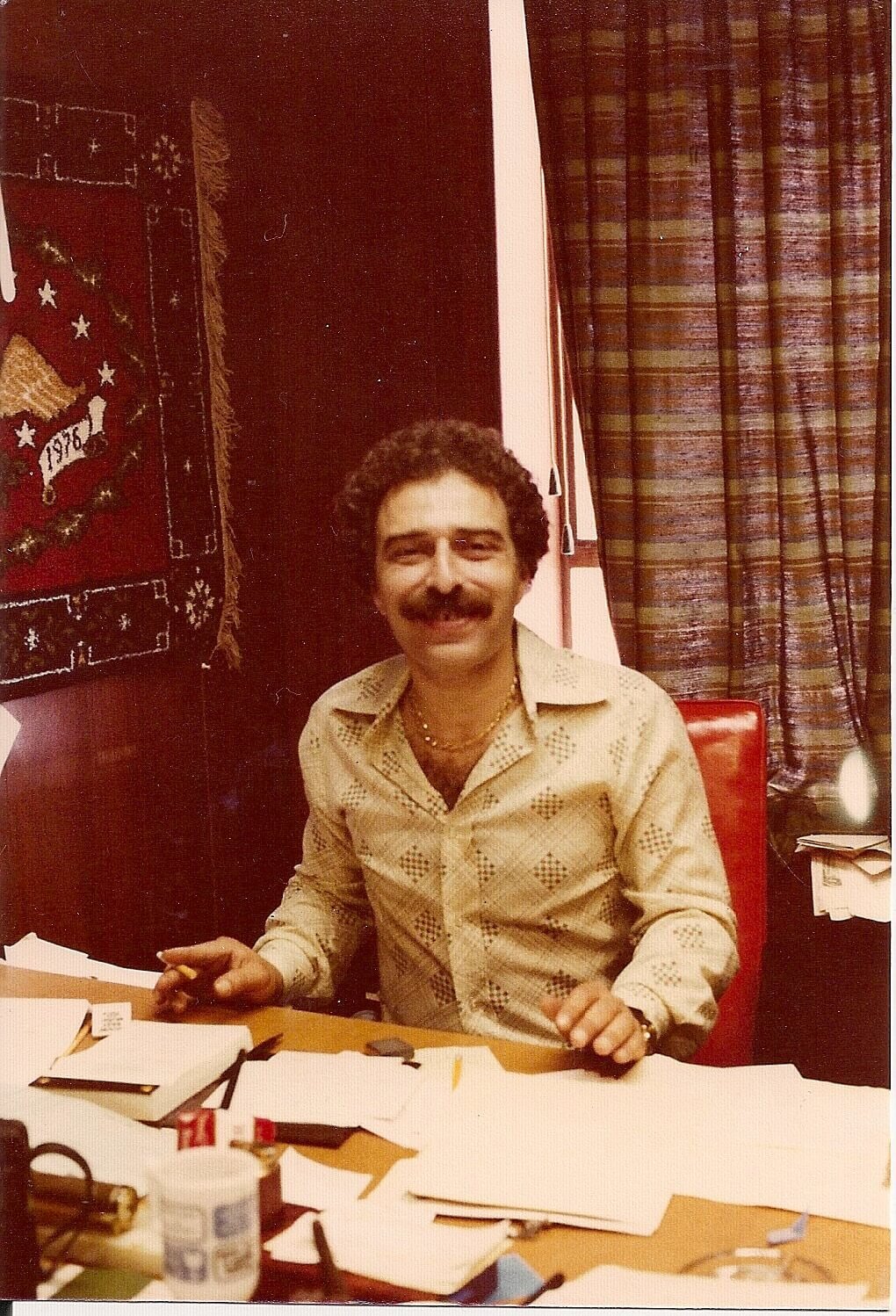 Warren Harris, Swatchtek and Flortek Founder, smiling at the office in 1978.