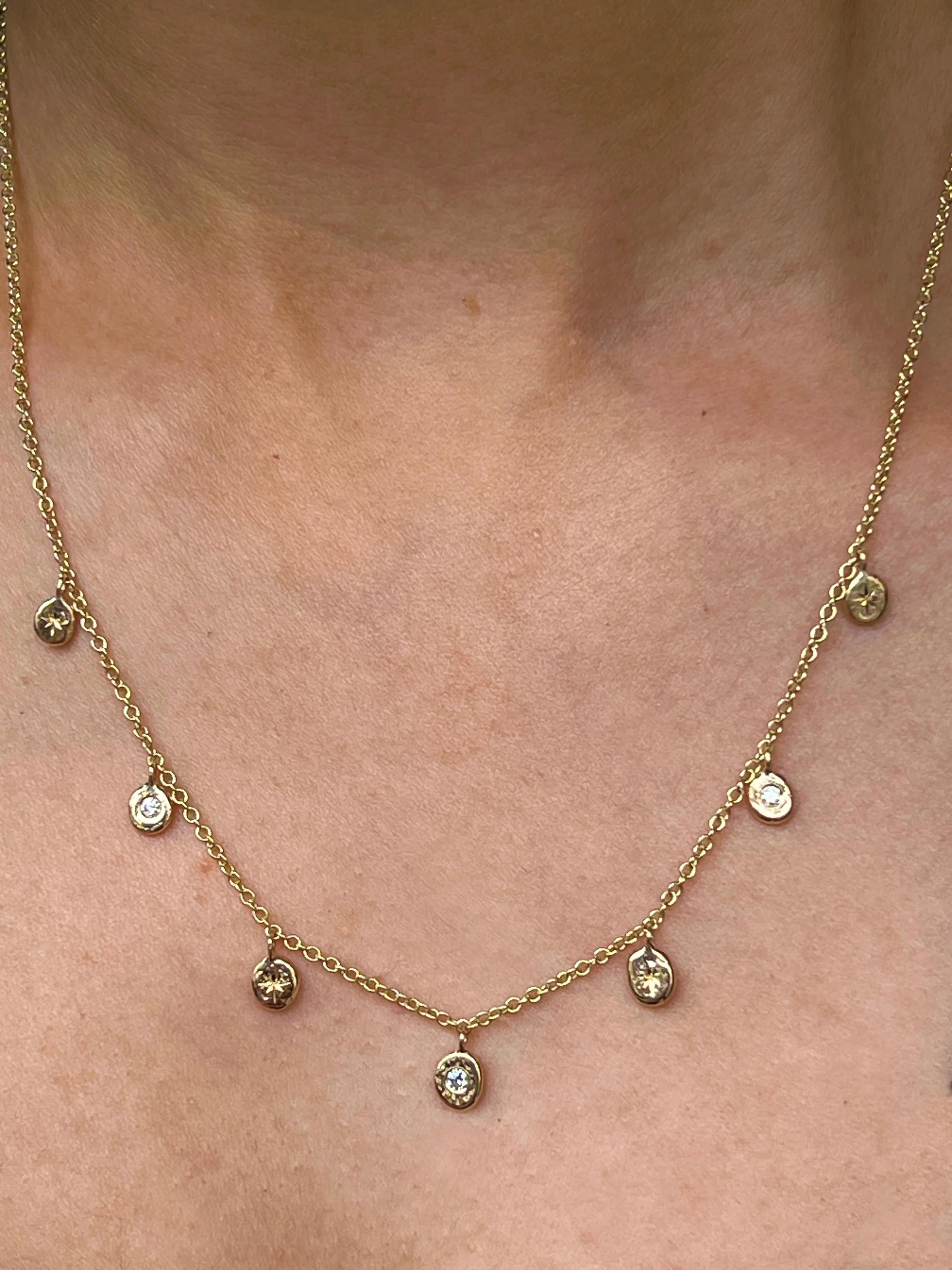Unveiling a new piece from our own collection has just been finished in our workshop! This 9ct gold necklace has small spaced pendant nuggets alternately flush set with sparkling diamonds in star settings and those in between embellished with engrave