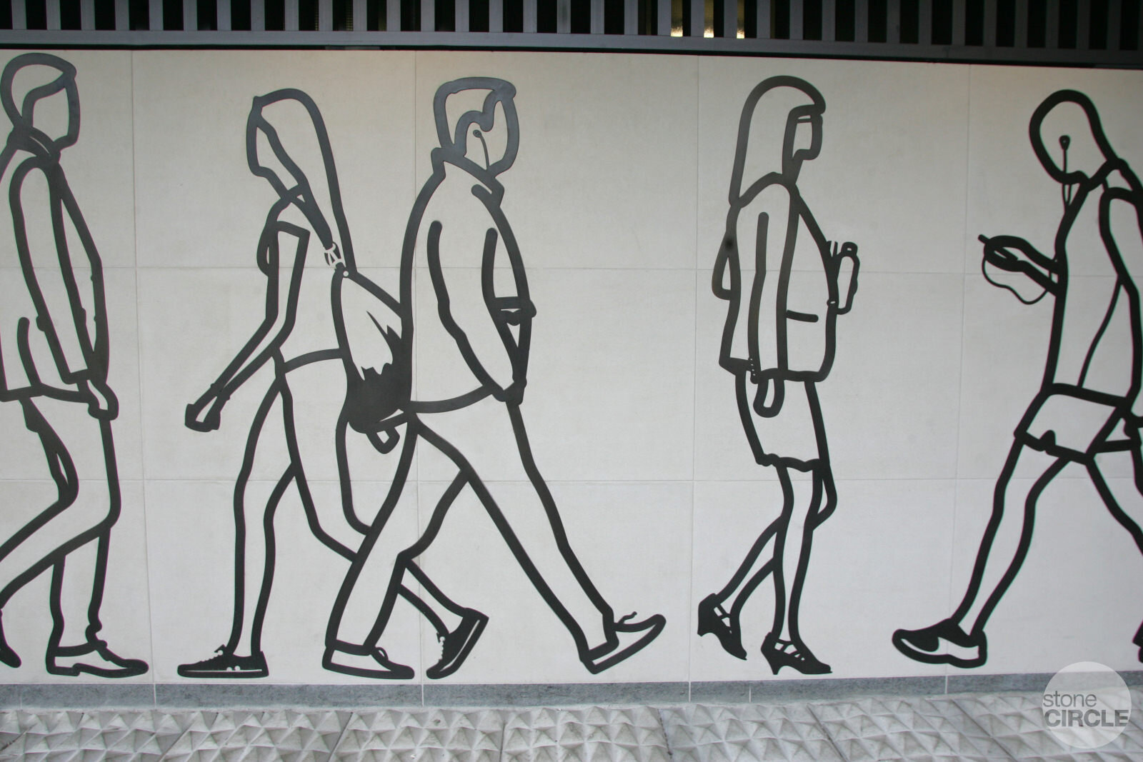 Julian Opie's frieze in Portland Stone and Patinated Bronze