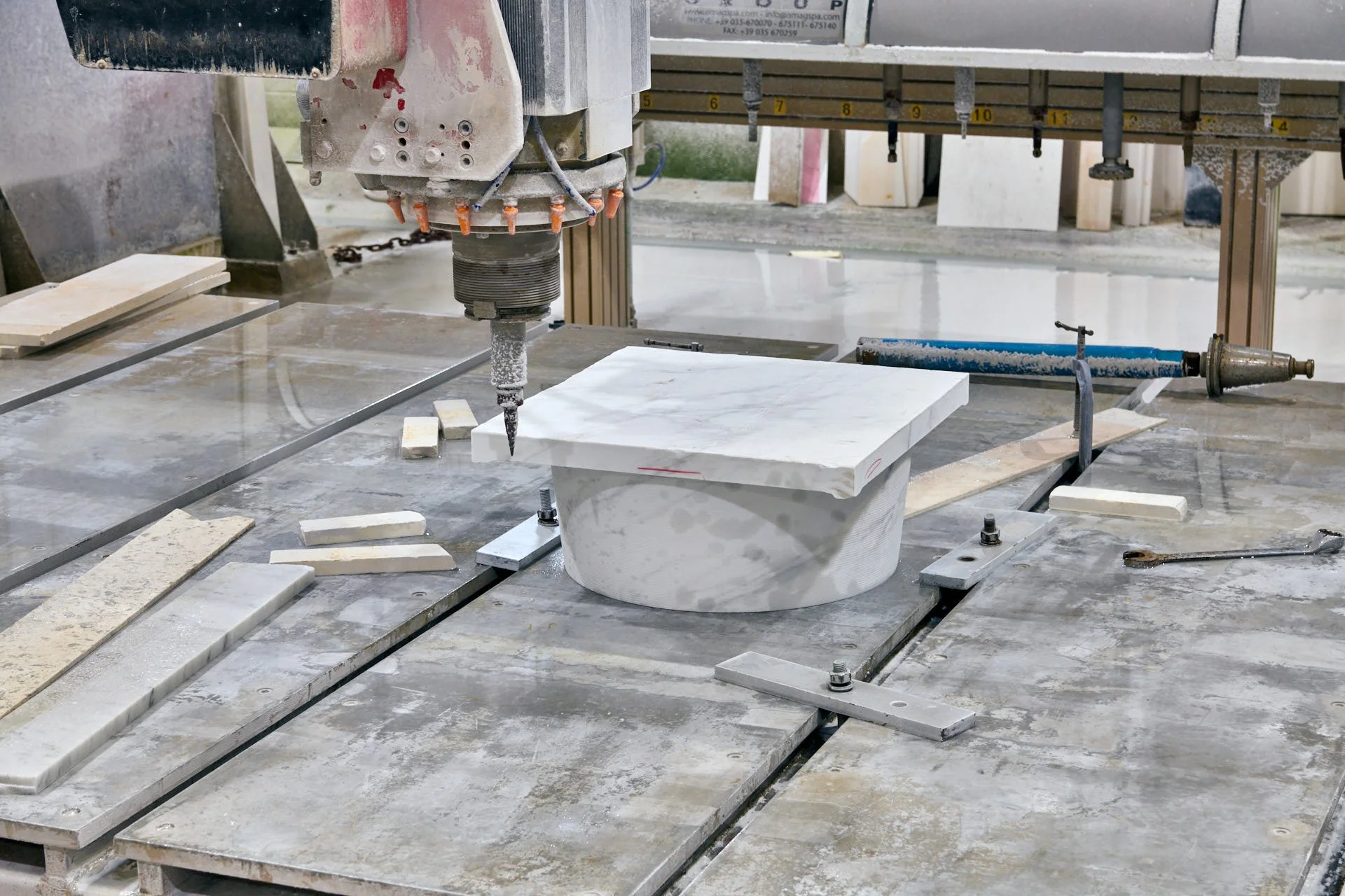 stoneCIRCLE factory -CNC machine carving a Carrara marble topstone for the Hull Maritime Waymarkers - photo Marco Joe Fazio Creatives