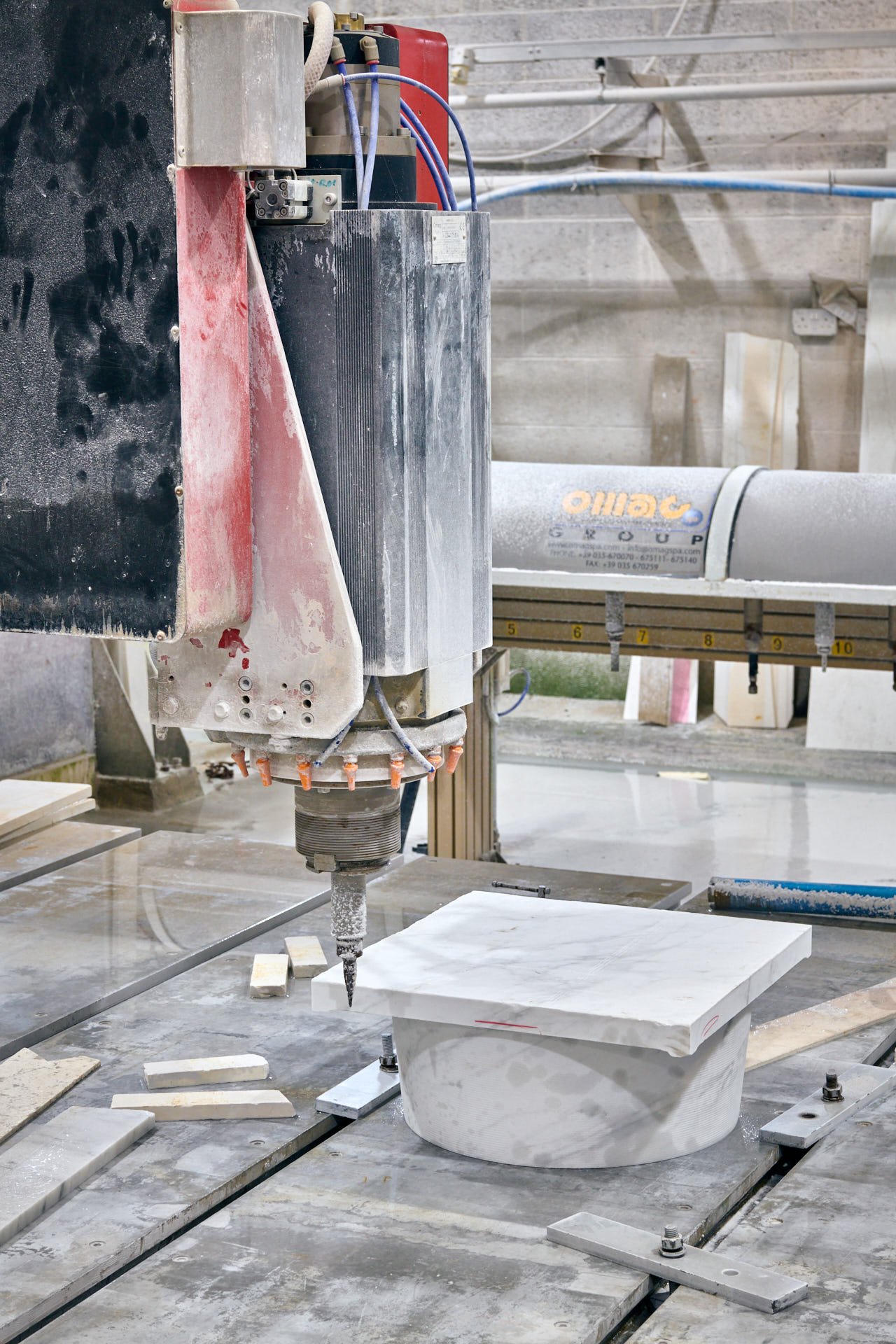 stoneCIRCLE factory -CNC machine carving a Carrara marble topstone for the Hull Maritime Waymarkers - photo Marco Joe Fazio Creatives