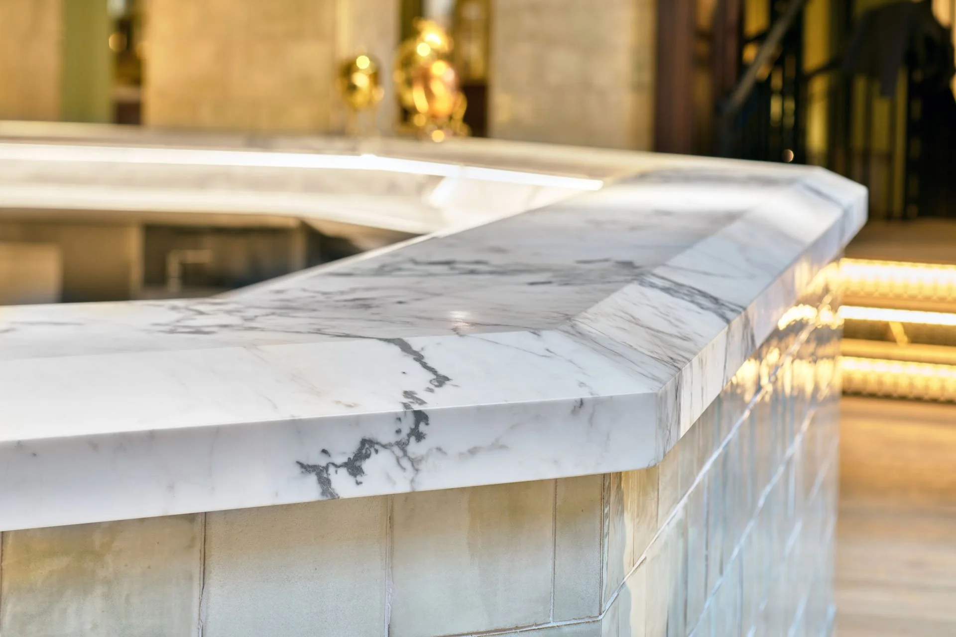 Finished stone bar or commercial counter fabricated and installed for an interior project - photo Marco Joe Fazio