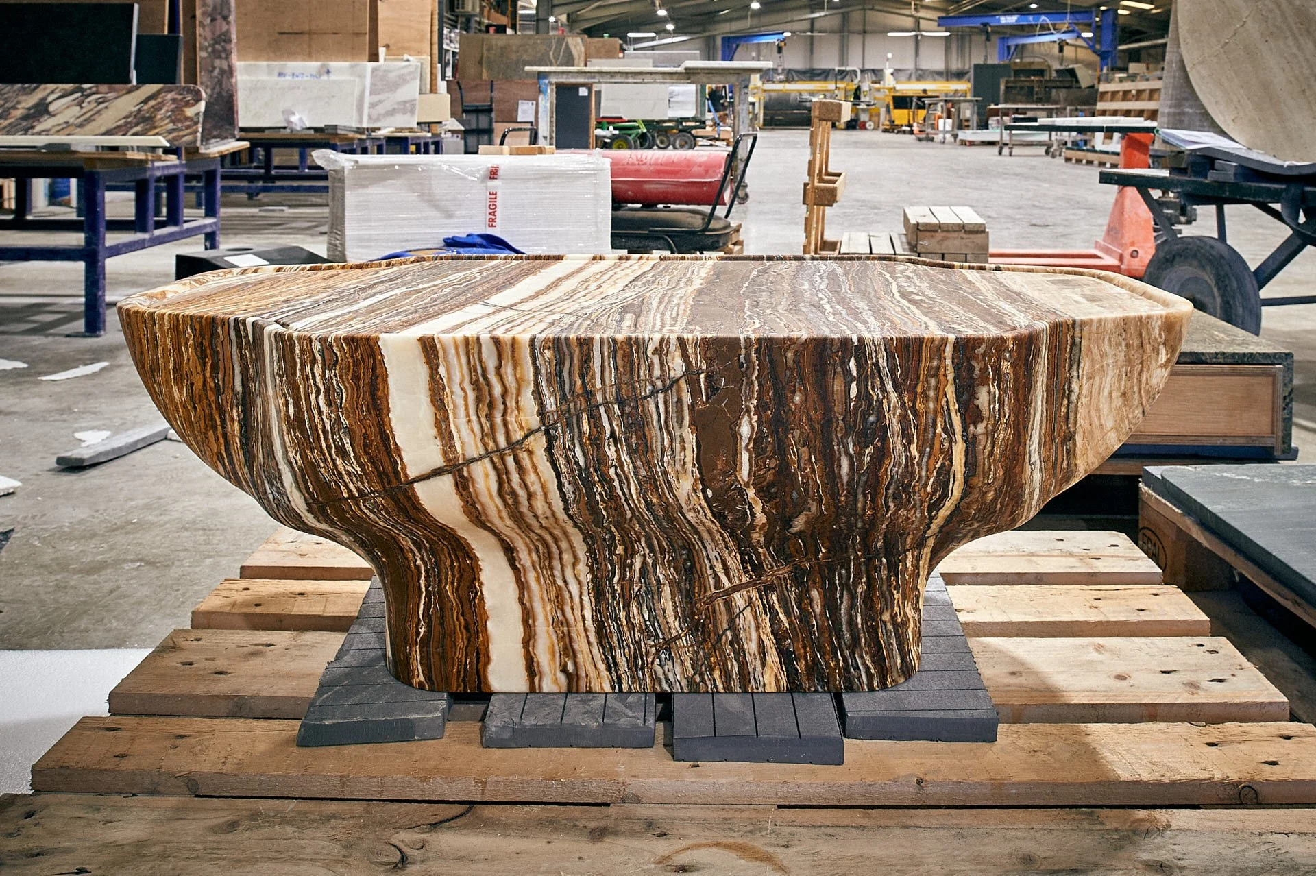 Tiger Onix anvil-shaped table by stoneCIRCLE, photo Marco Joe Fazio Creatives