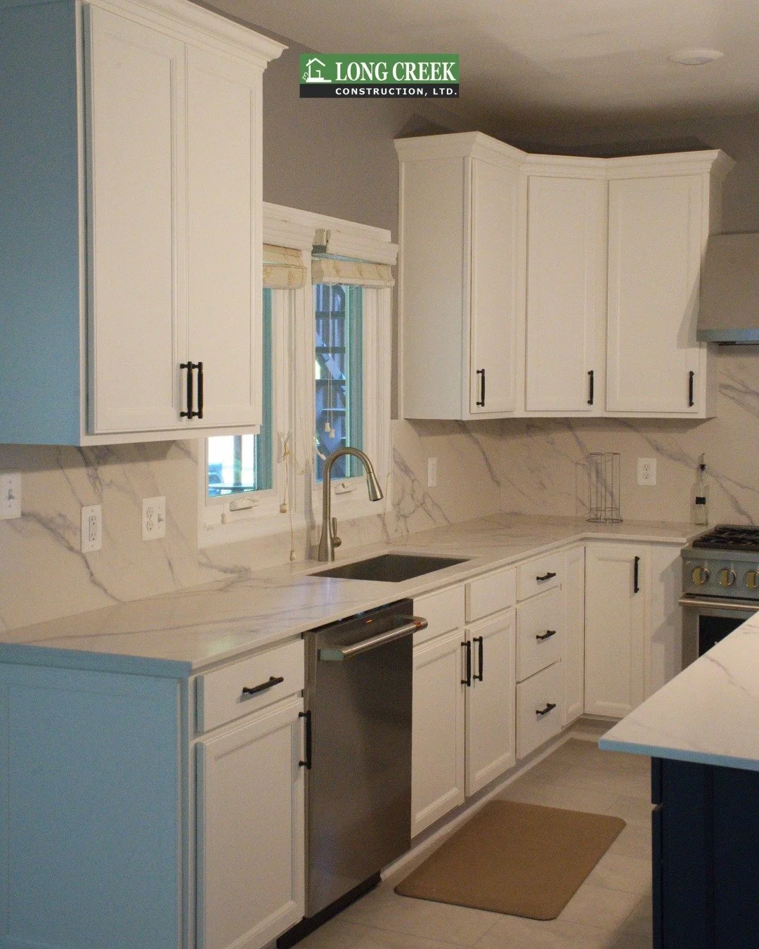 Take a look at this stunning kitchen remodel we completed here in Bowie, MD! Featuring sleek white cabinetry, marble countertops, and stainless steel appliances, this space is both stylish and practical. Interested in elevating your home's interior? 
