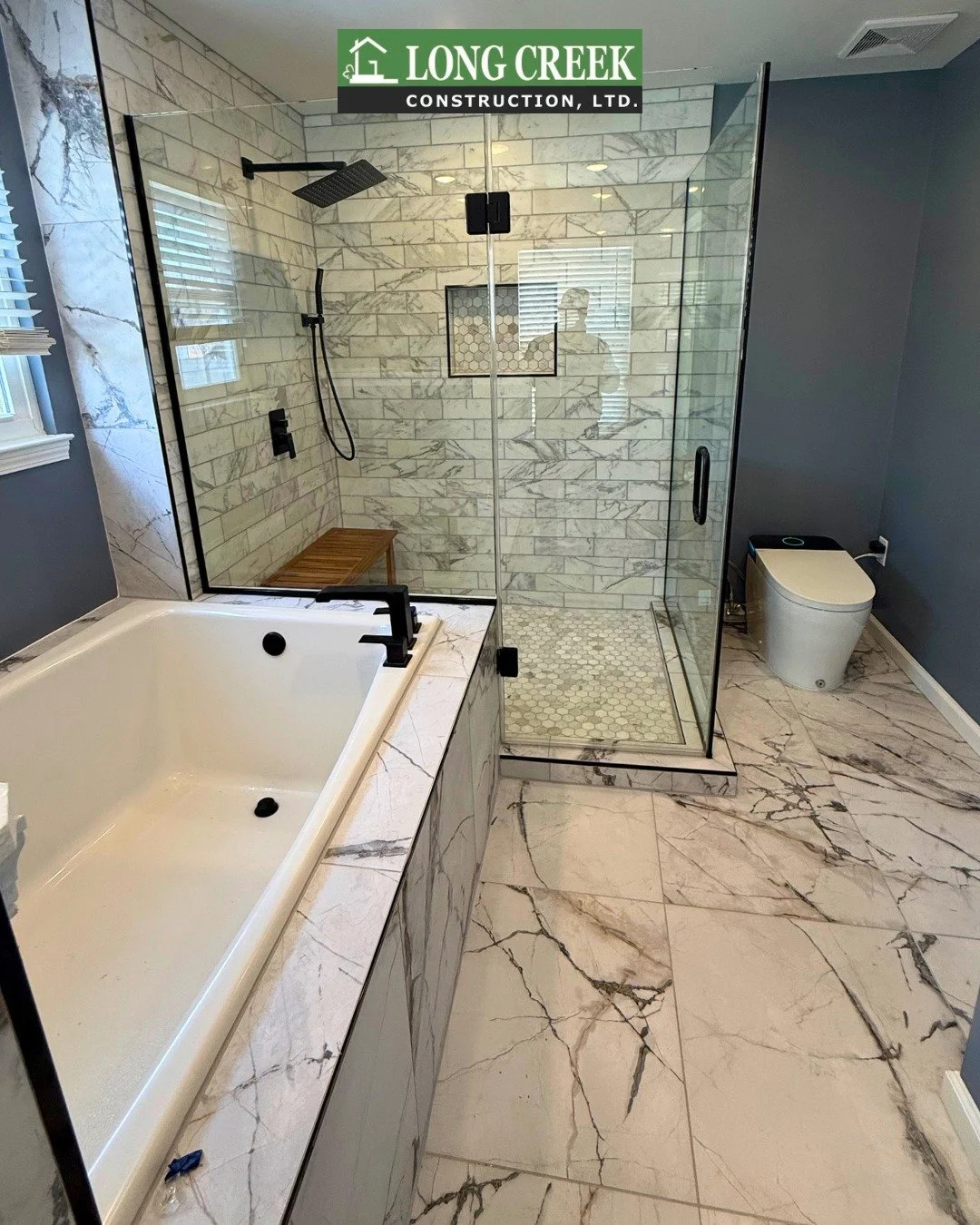 Another job well done by Long Creek Construction! 

Take a look at this stunning bathroom upgrade we're finishing up in Cheltenham. Matte black fixtures, a custom glass shower, smart toilet/bidet and a warm-toned wood vanity make this bathroom the pe