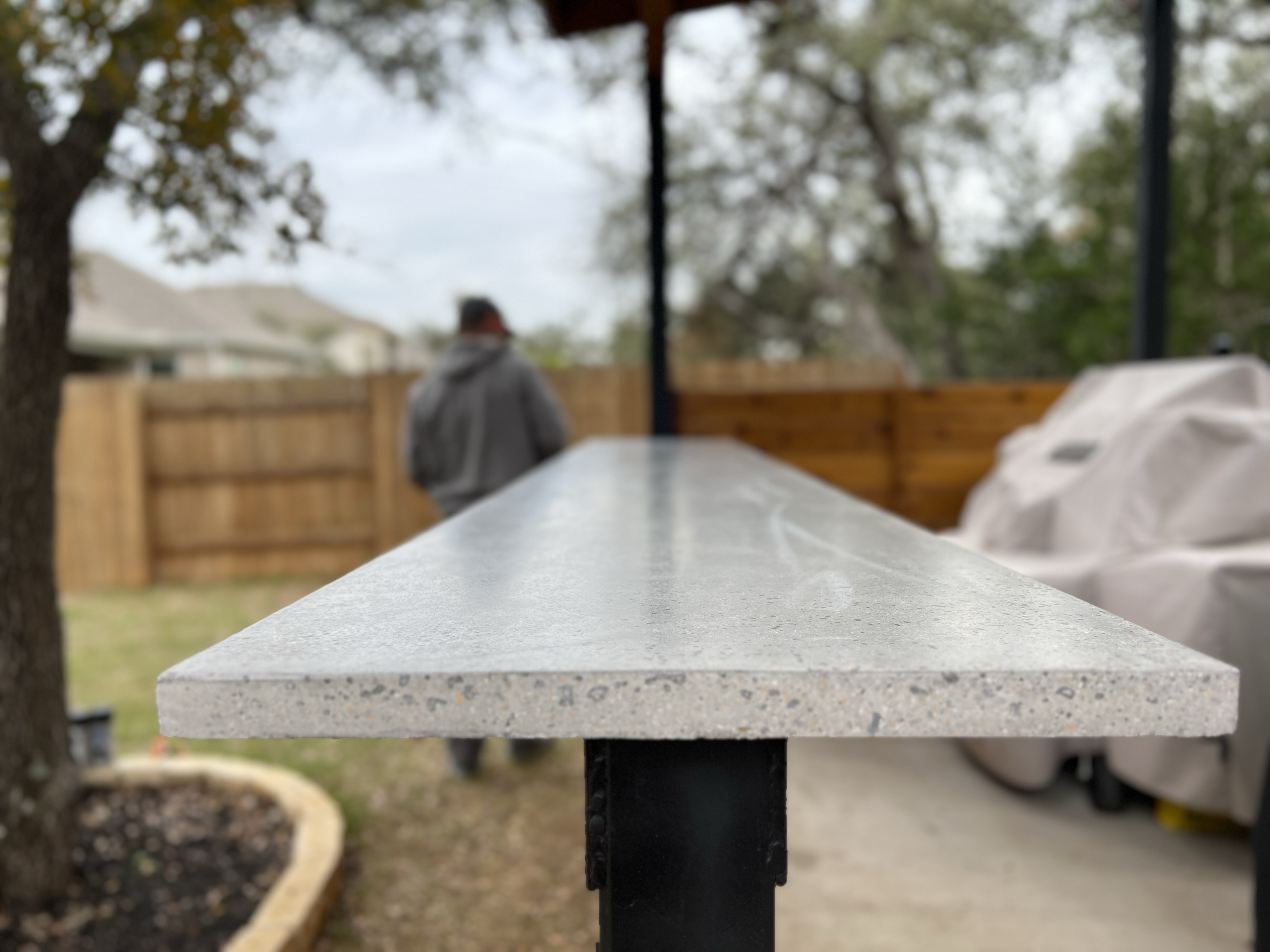 Outdoor kitchen with custom concrete countertops- Dripping Springs
