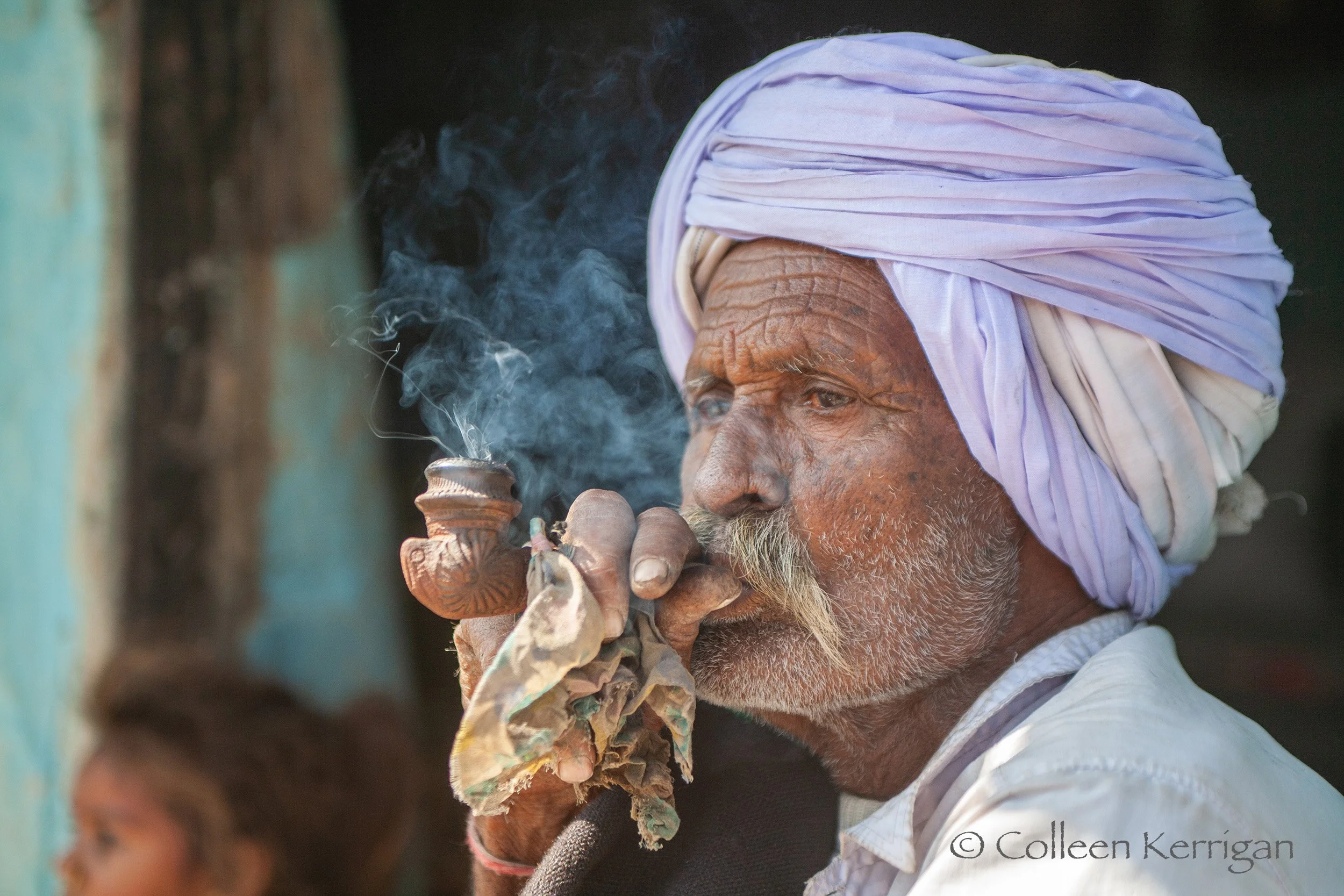 "Enjoying a Pipe" - elderly gentleman in a purple turban enjoys a pipe 
