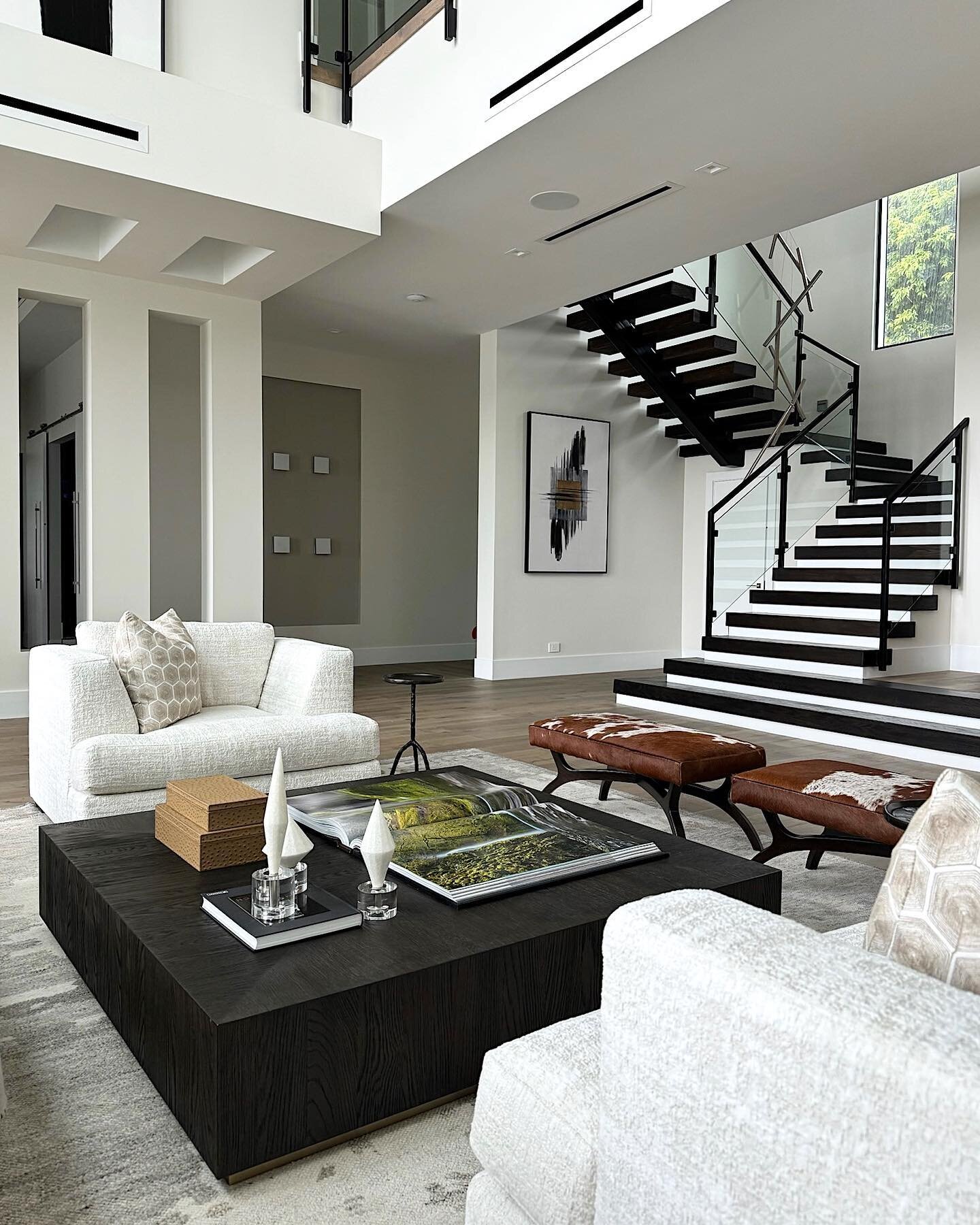 This home captured our hearts with all the great details it has. When entering the home we selected two natural hide ottomans to elevate the style in the living room. We love putting those unique touches in our designs! #imaginethatdesign