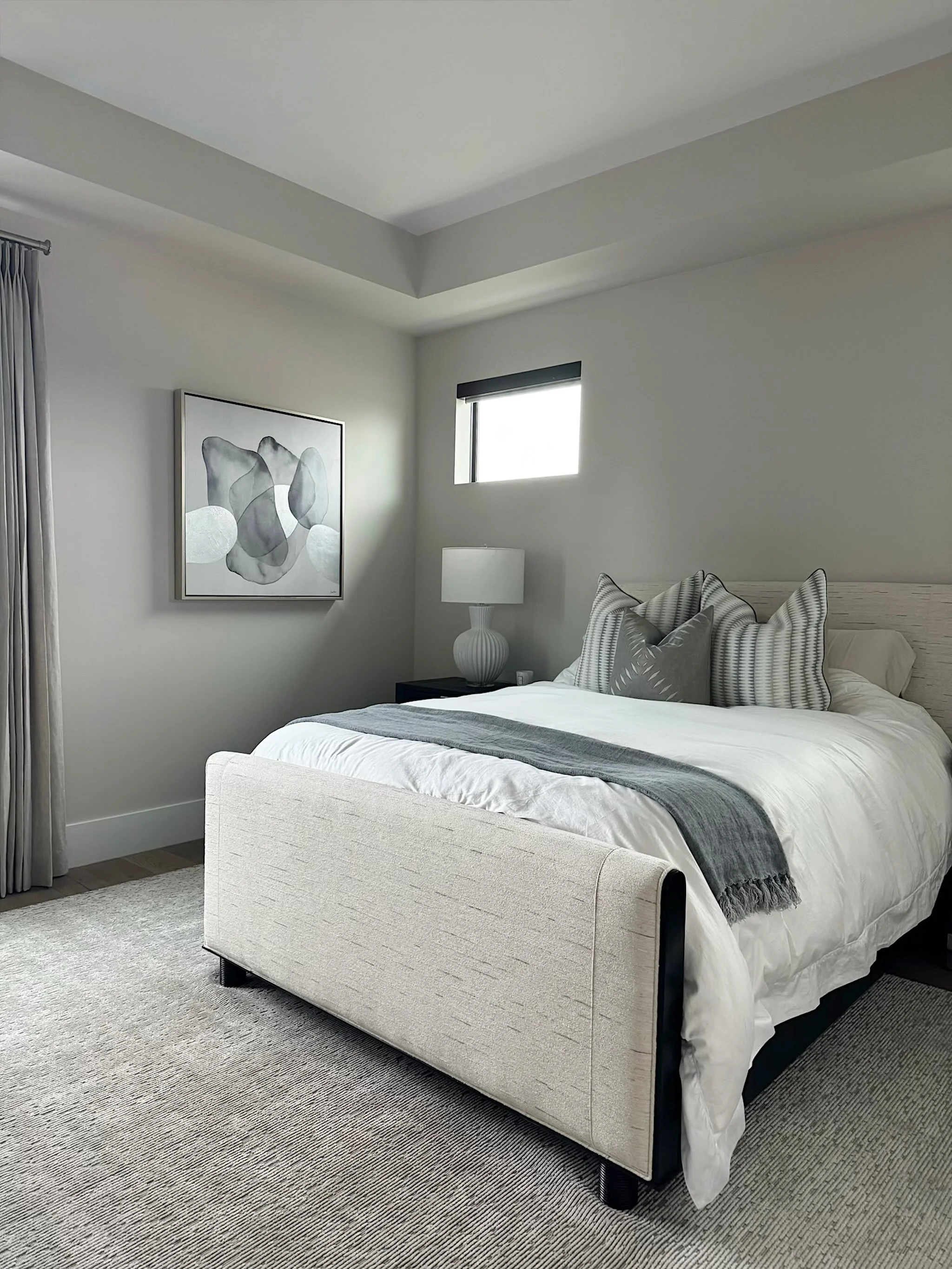 We gave this guest bedroom a simple, yet elevated design to make their stay feel like a true home away from home. 

#imaginethatdesign #interiors #guestbedroom #bedding #abstractart