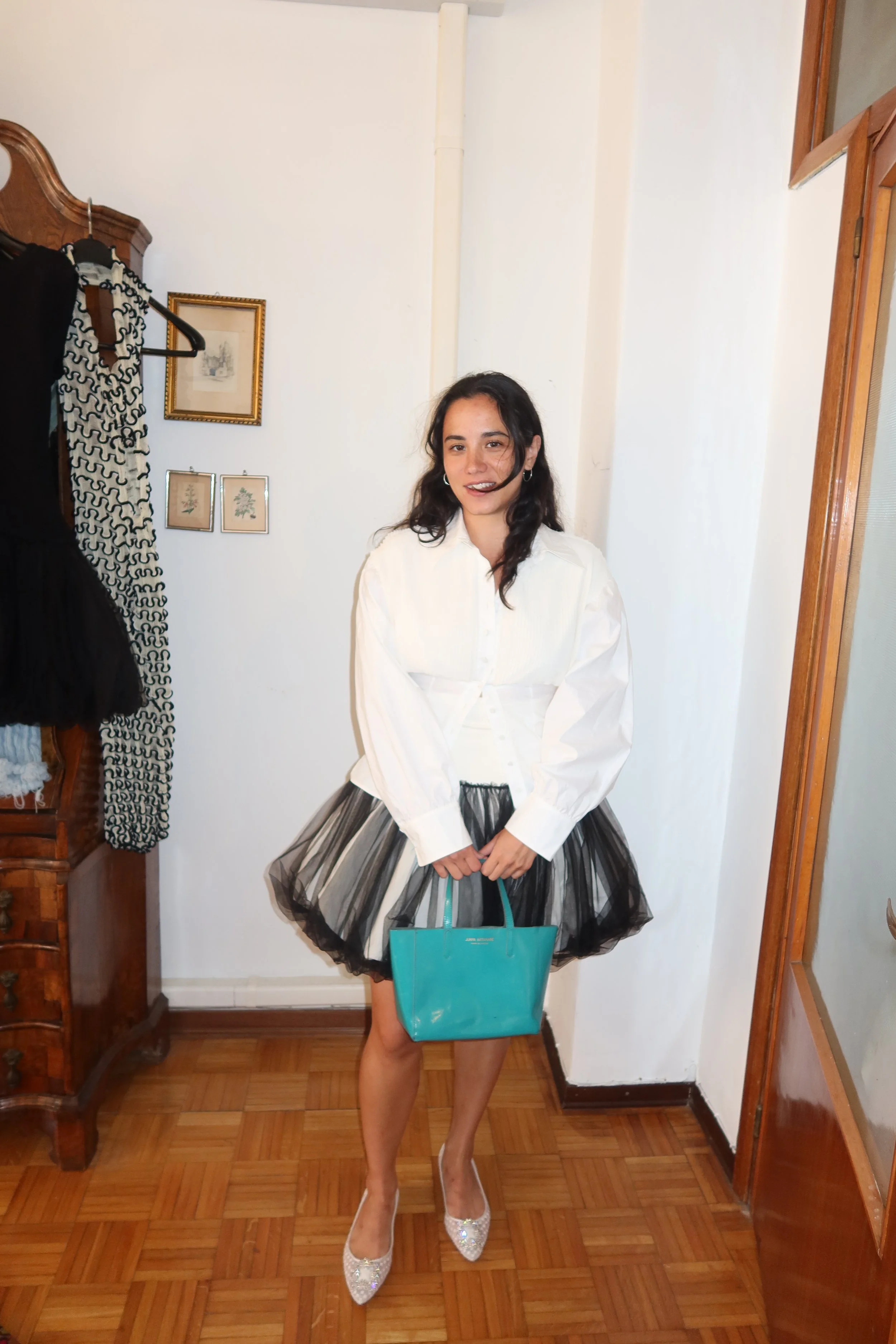 Jeannie wears Renaissance Renaissance Skirt and Shirt, Junya Watanabe purse and Manolo pumps.