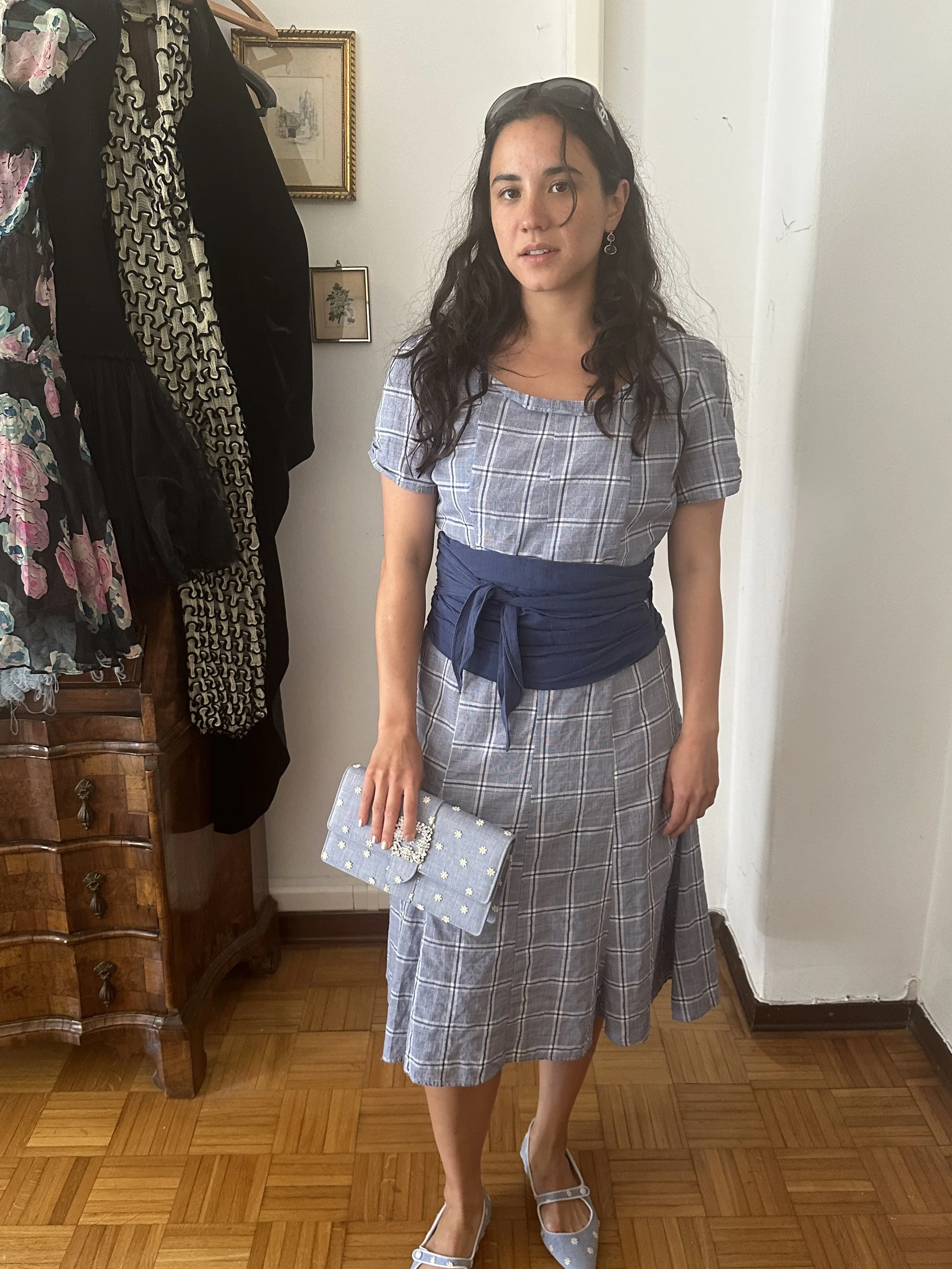 Jeannie wears dress made by TH, Vintage Chanel Glasses, Manolo Blahnik pumps and clutch bag.