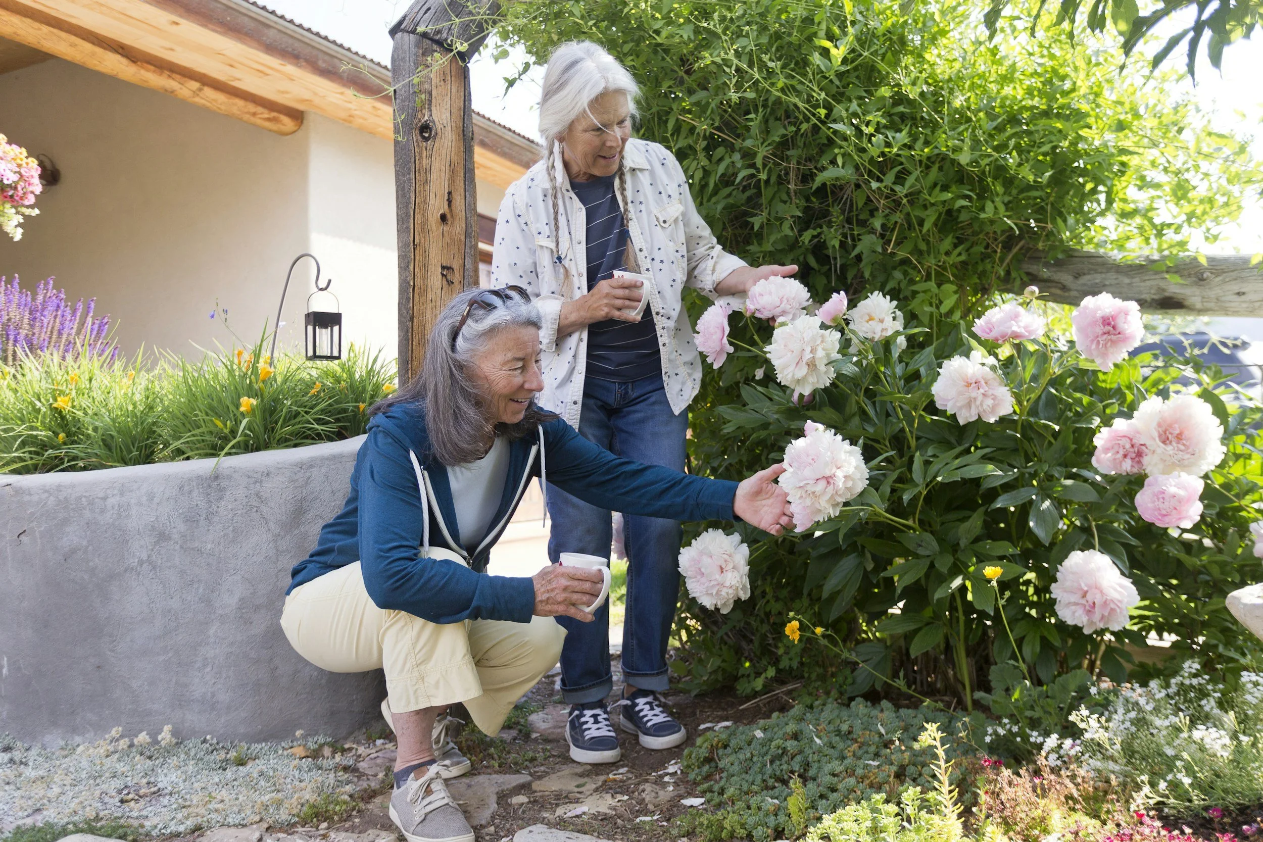Elderly couple gardening in their front yard. Chiropractic care for older adults so they can keep up with their normal activities. Port Elgin Ontario chiropractor. Bruce Village Chiropractic.