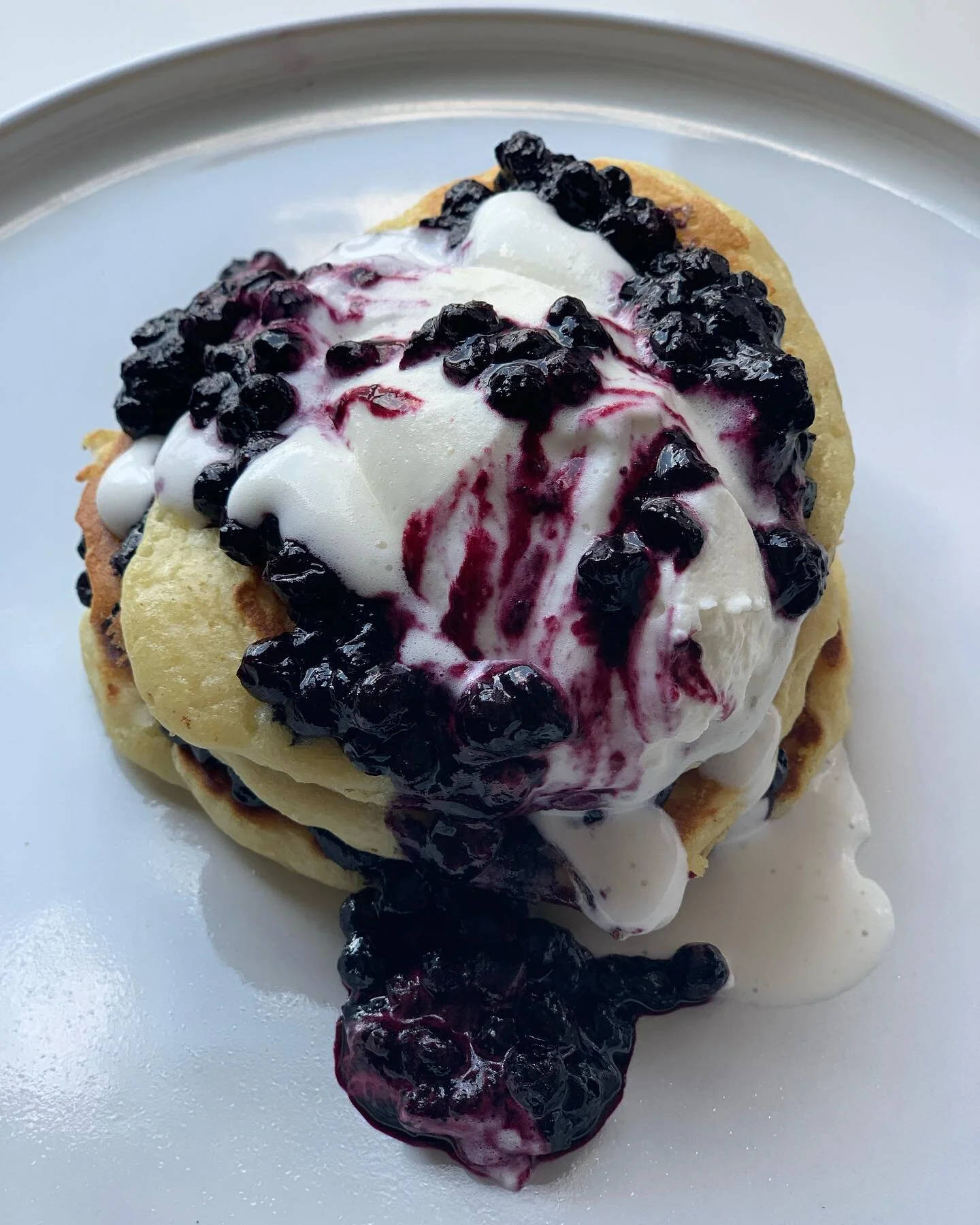 Buttermilk pancakes with blueberry compote, served with fresh whipped cream (in what was a well executed quenelle).