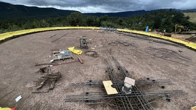 Construction begins at the base of the new tank