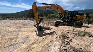 Breaking ground (and rock!) for tank foundation