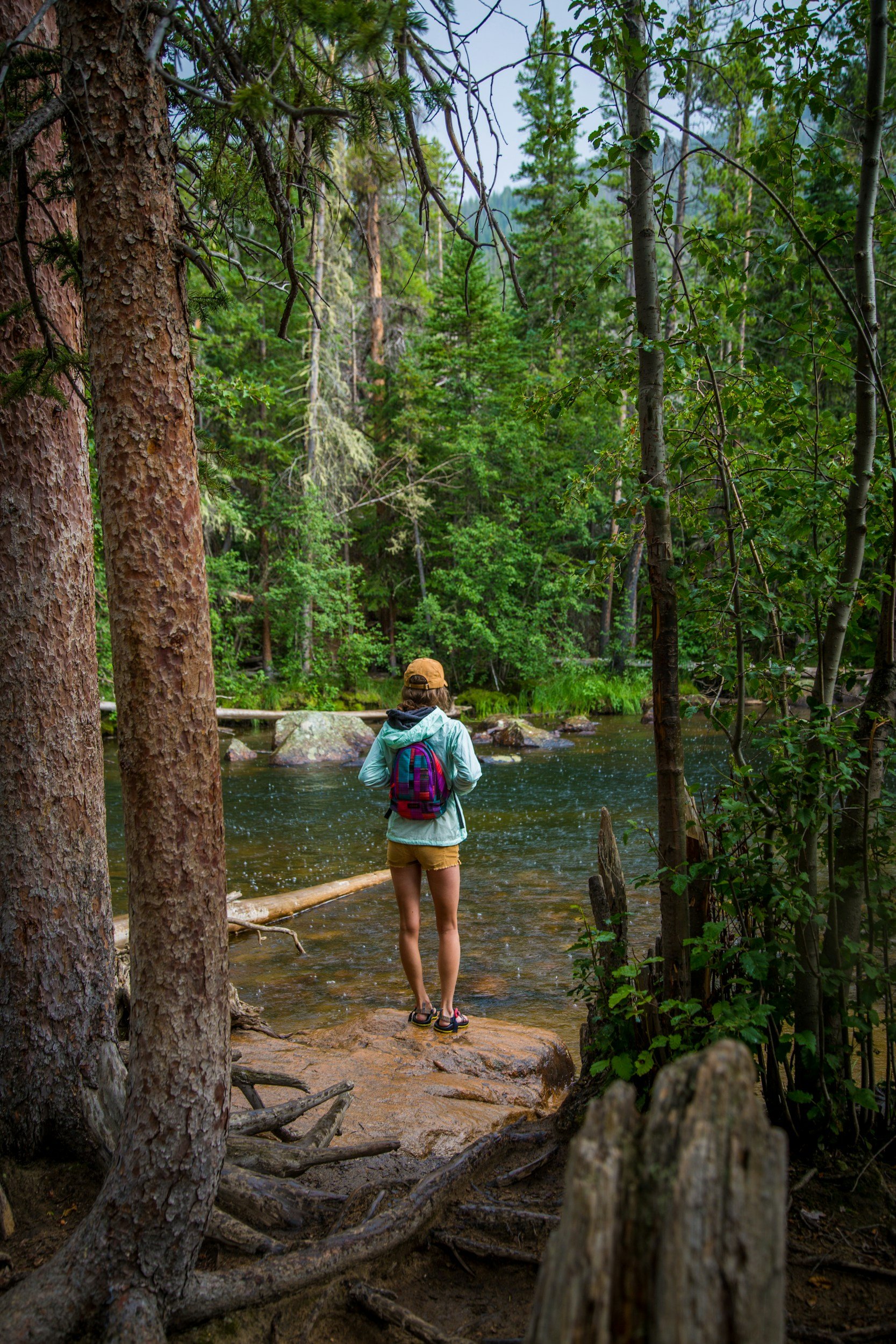 Person finding nervous system calm in Colorado nature representing somatic therapy healing at Soul Yoga Counseling