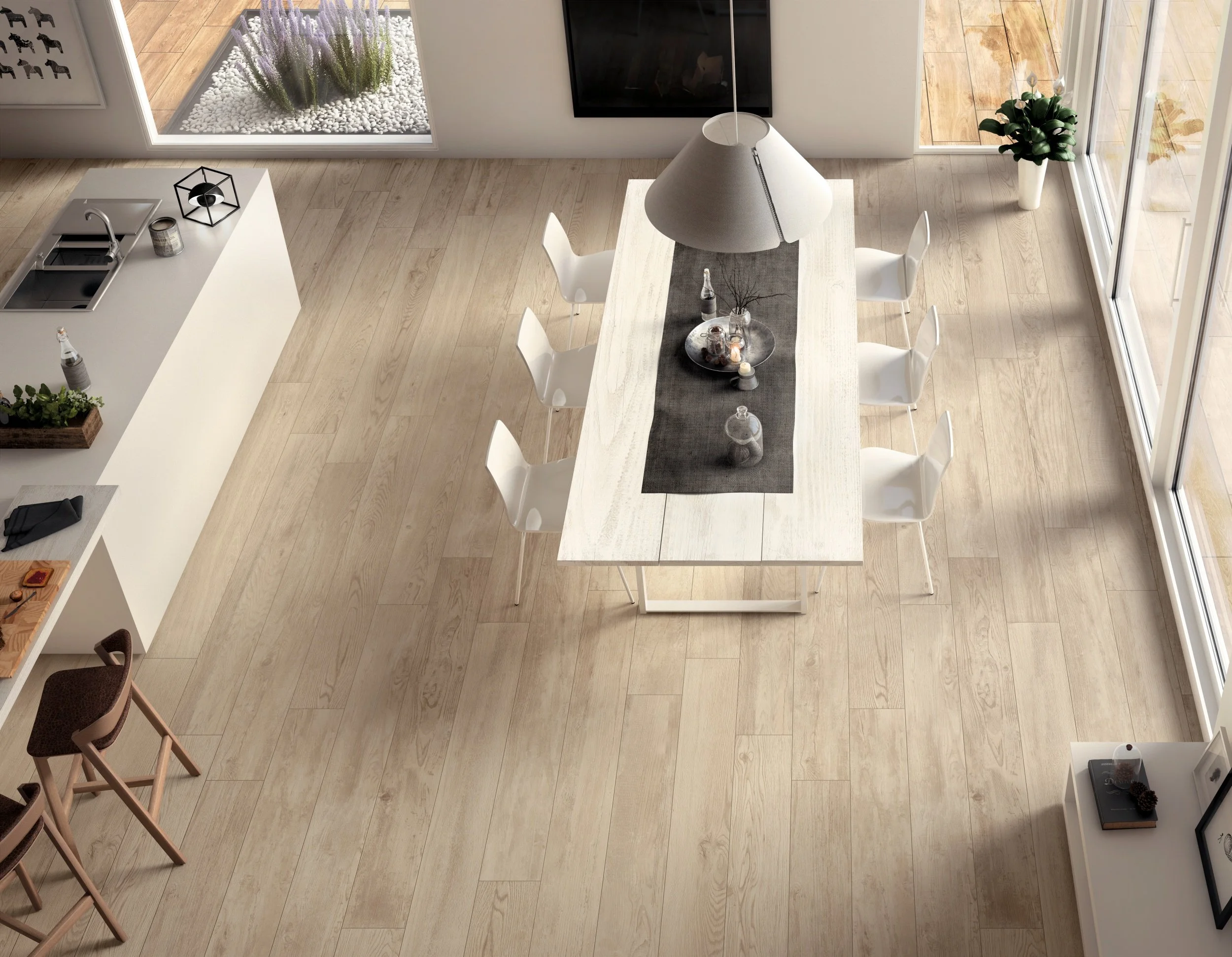 Wide plank porcelain wood look tile flooring in a bright Toronto interior.