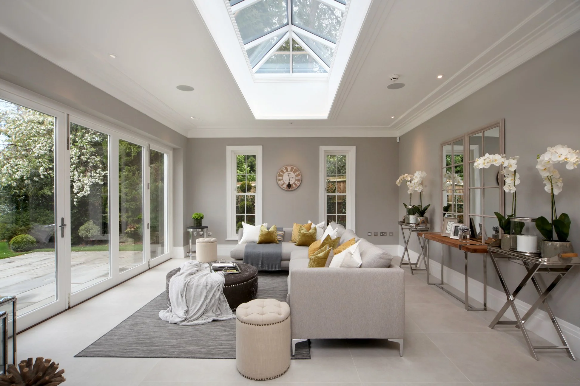 Contemporary space finished with concrete look porcelain tiles.