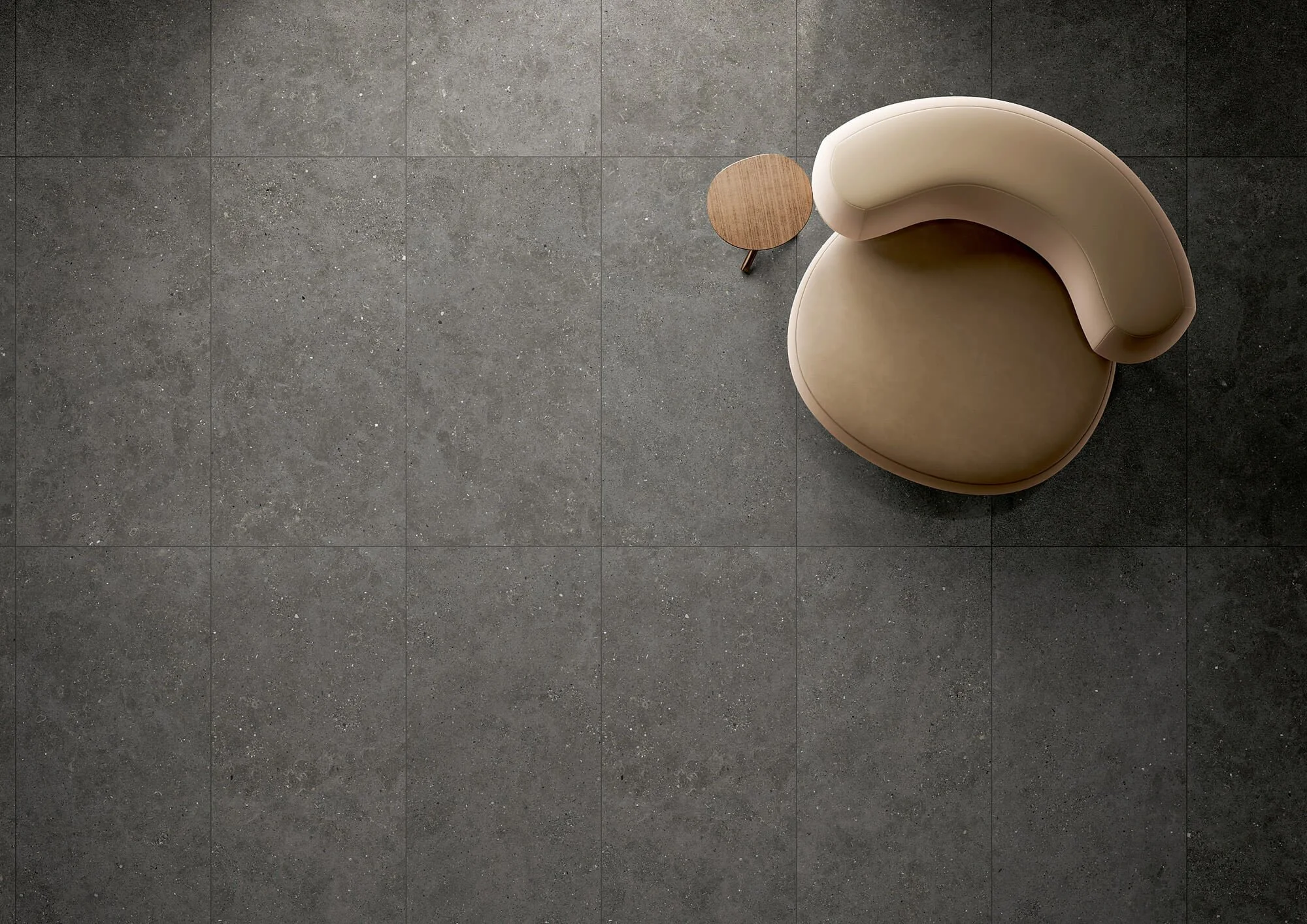 Concrete effect porcelain tile floor with a seamless and uniform appearance.