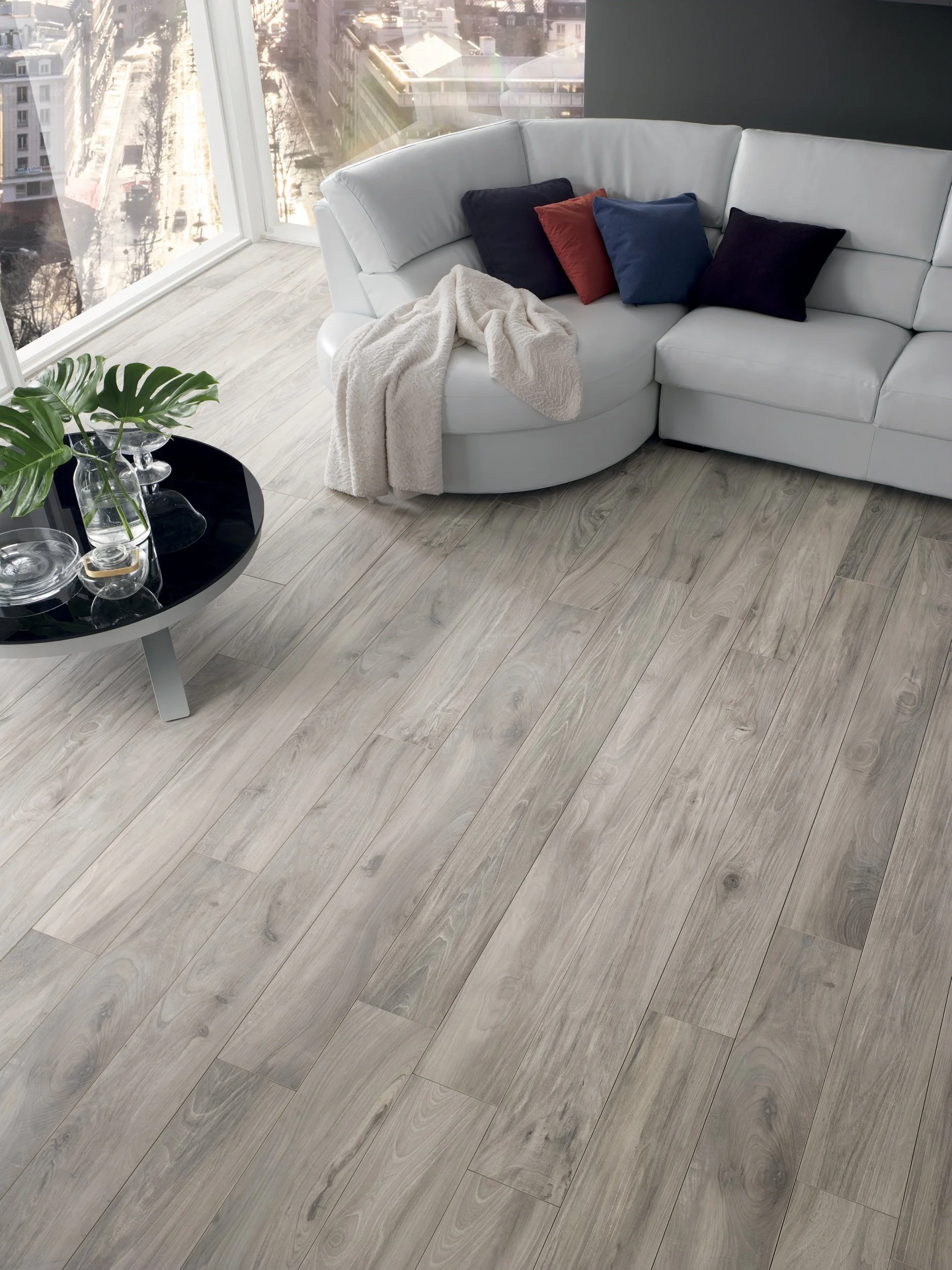 Porcelain wood look plank flooring offering durability and natural appearance.