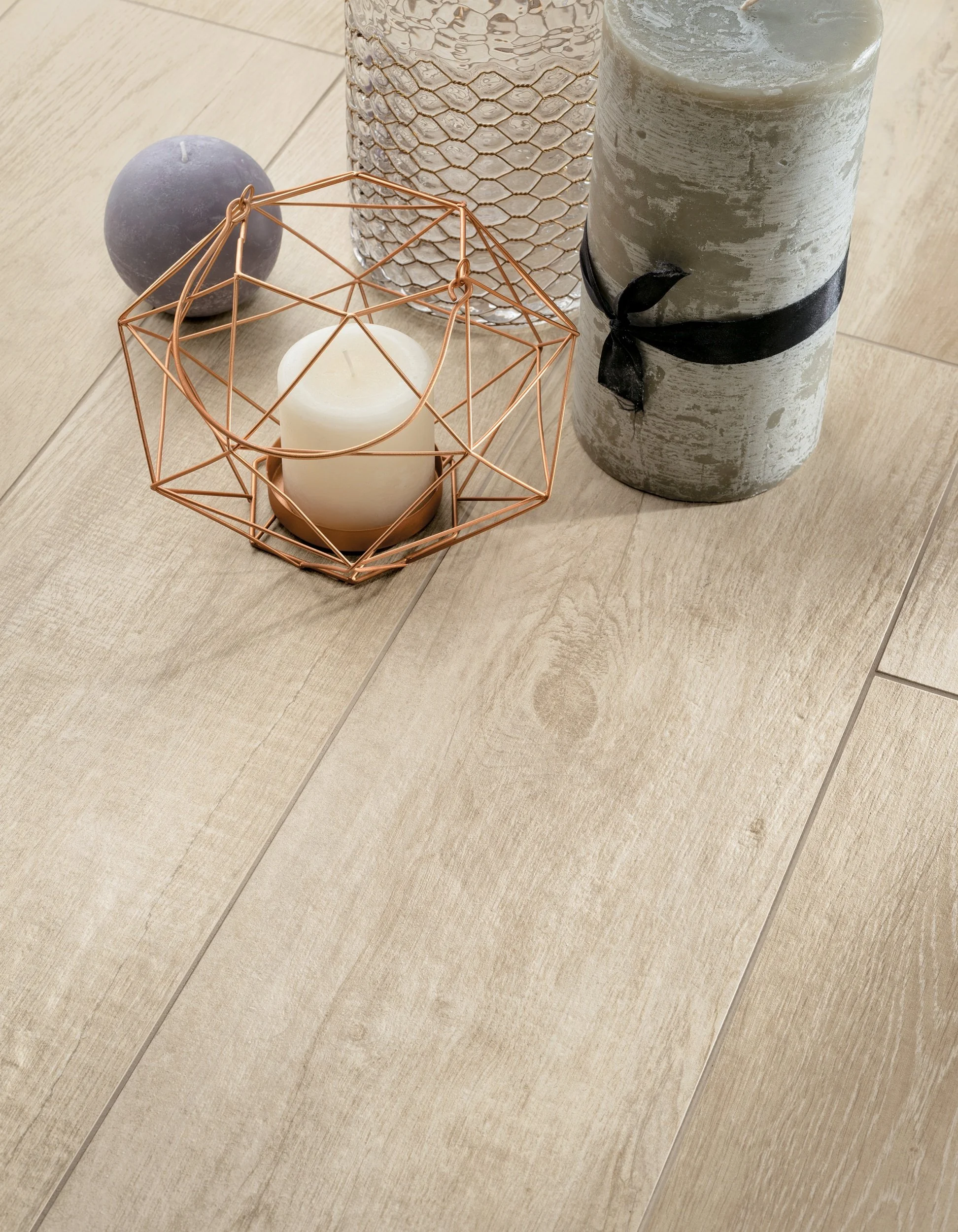 Modern design complemented by wide plank wood look porcelain tile flooring.