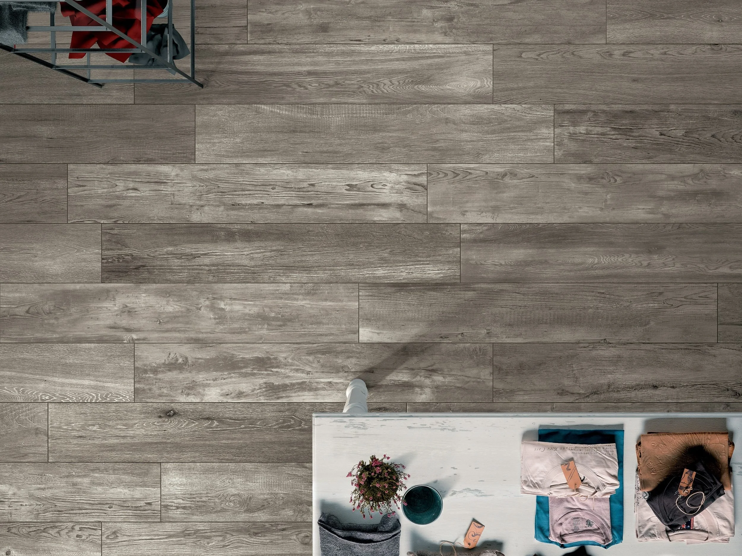 Wide plank wood style porcelain tile creating a natural and modern aesthetic.