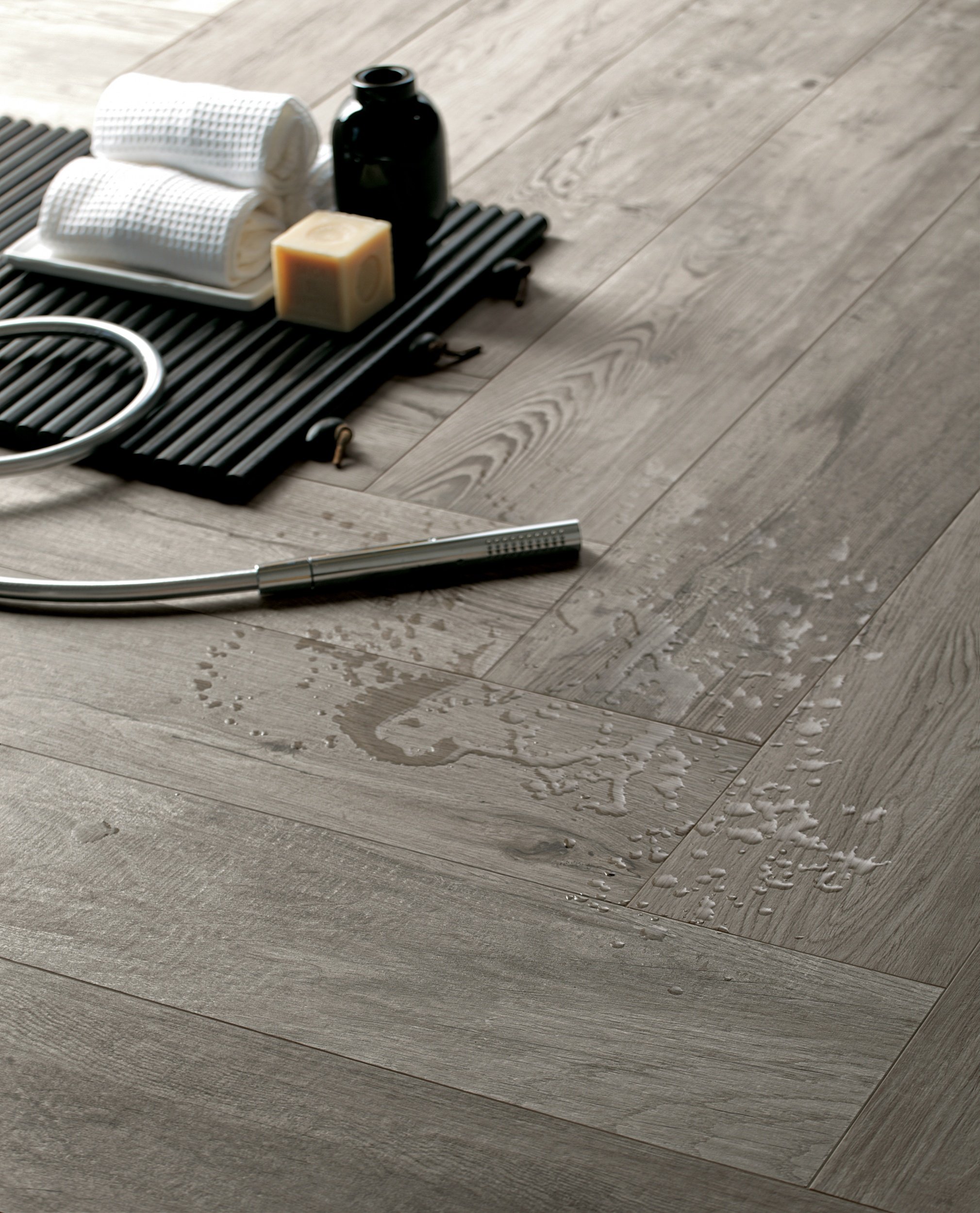 Modern interior featuring wide plank wood look porcelain tile by Sapphirus Stone & Tile.