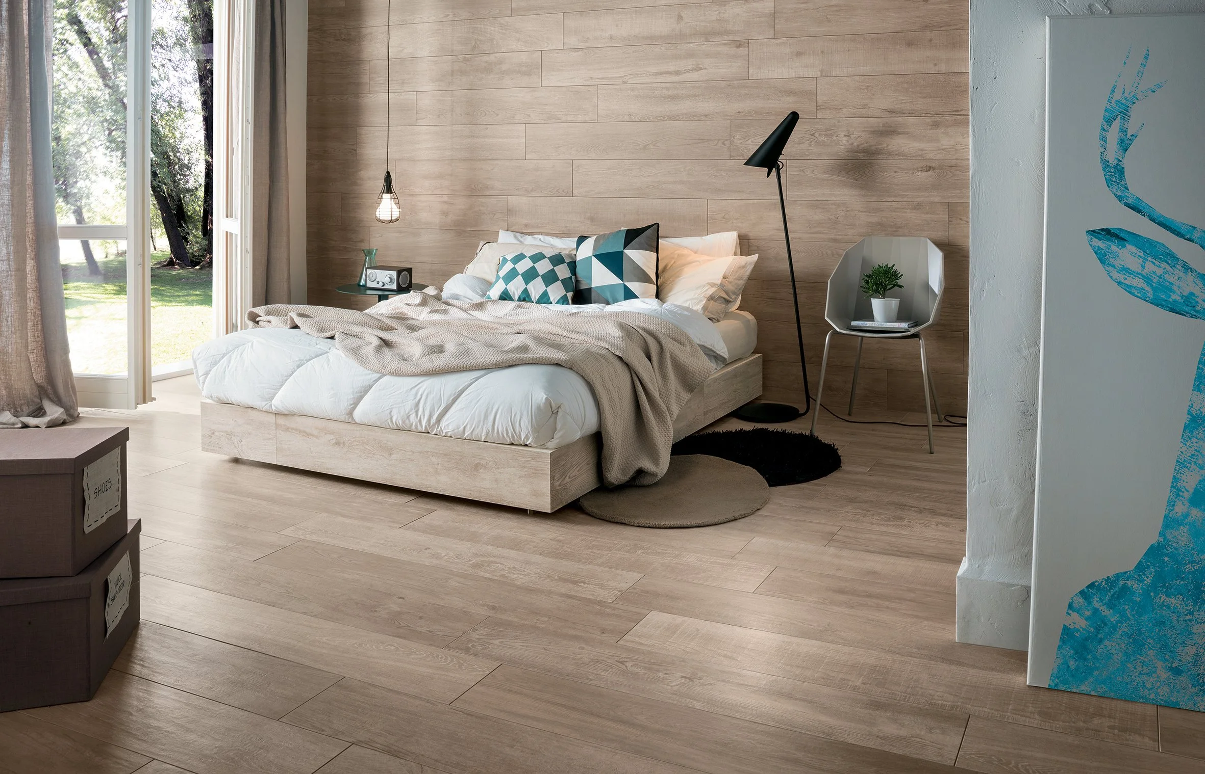 Contemporary space enhanced with wide plank wood style porcelain tile.
