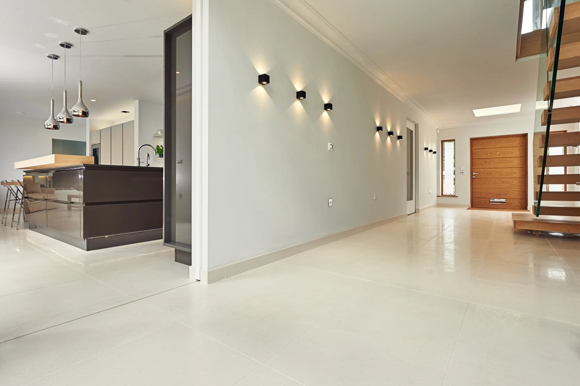 Modern concrete look porcelain tile flooring with a smooth matte finish in a Toronto interior.