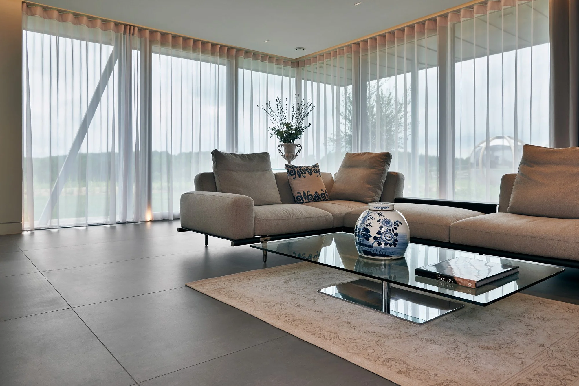 Concrete look porcelain tile enhancing modern open-plan spaces.