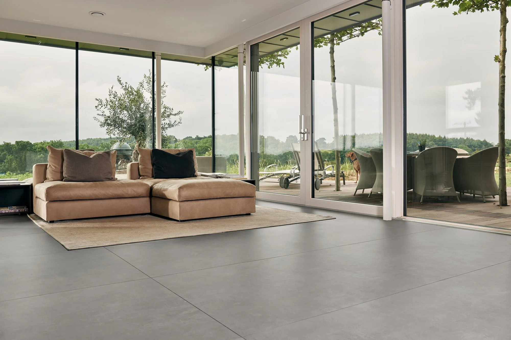 Modern concrete look tile flooring with clean architectural lines.