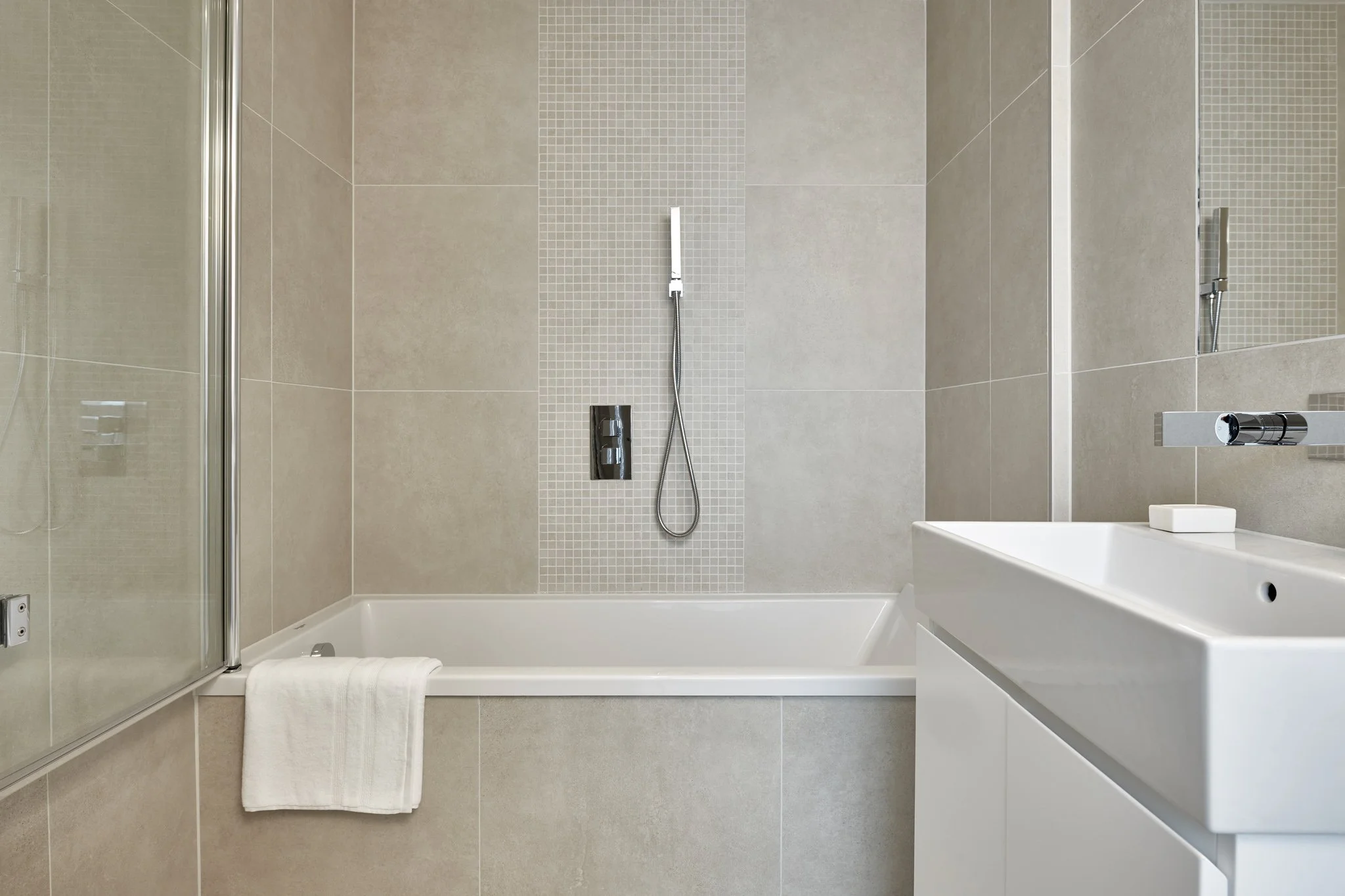 Concrete effect tile offering a clean and architectural appearance.