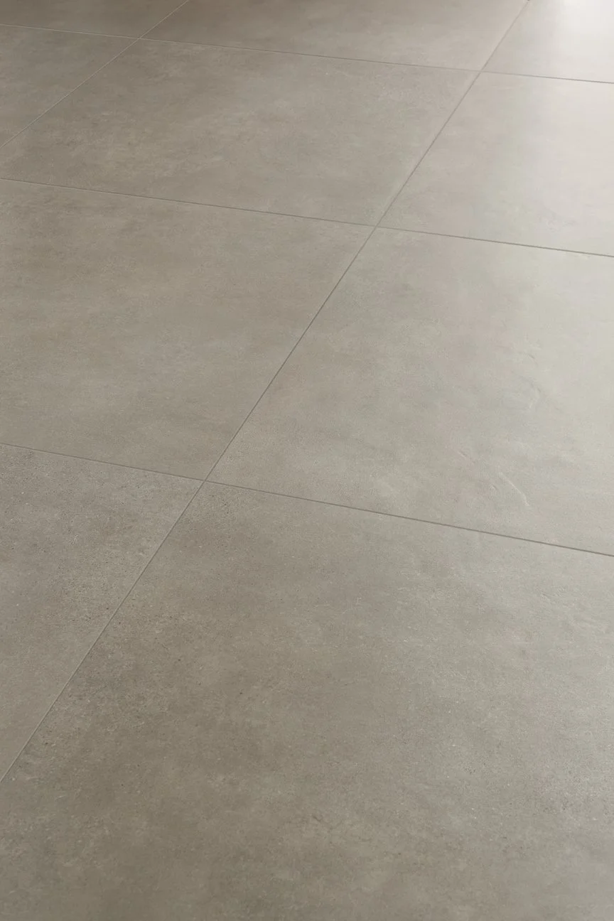 Subtle grey concrete look tile creating a modern and balanced interior aesthetic.