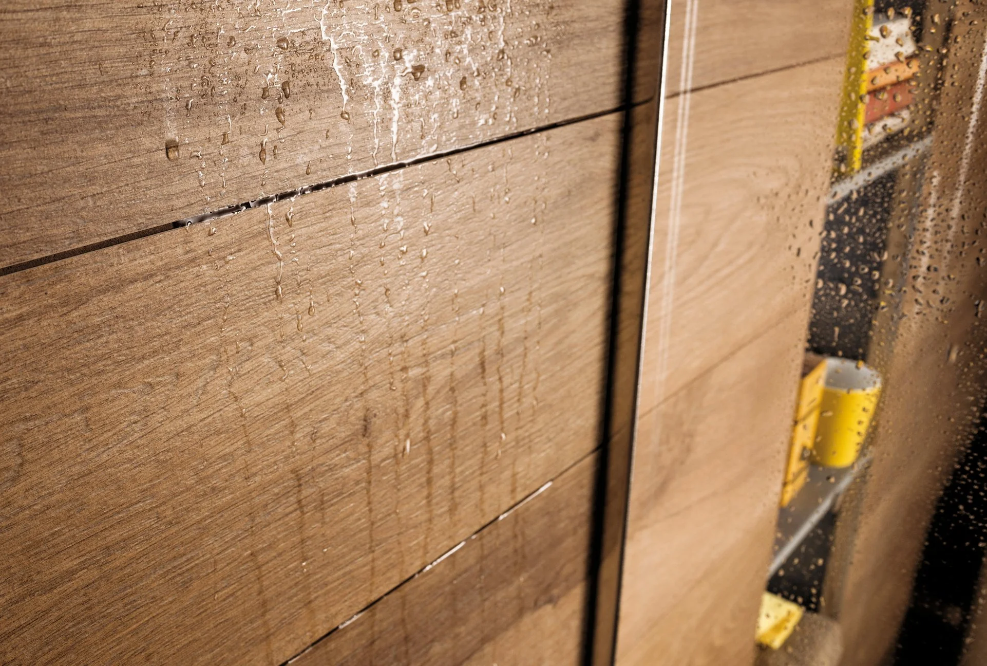 Contemporary space featuring wood look porcelain tile flooring by Sapphirus Stone & Tile.