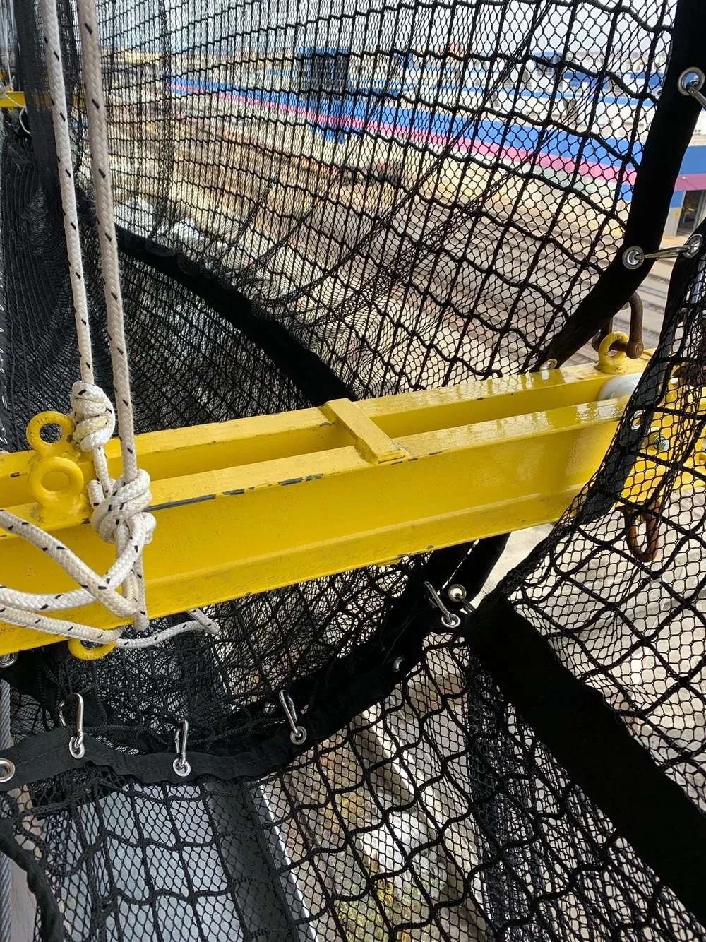 EPS engineered outrigger system supporting debris containment netting providing fast installation and reduced labor on construction projects