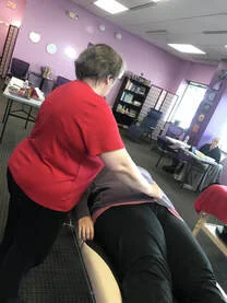 Bobbi with student in classroom.jpeg