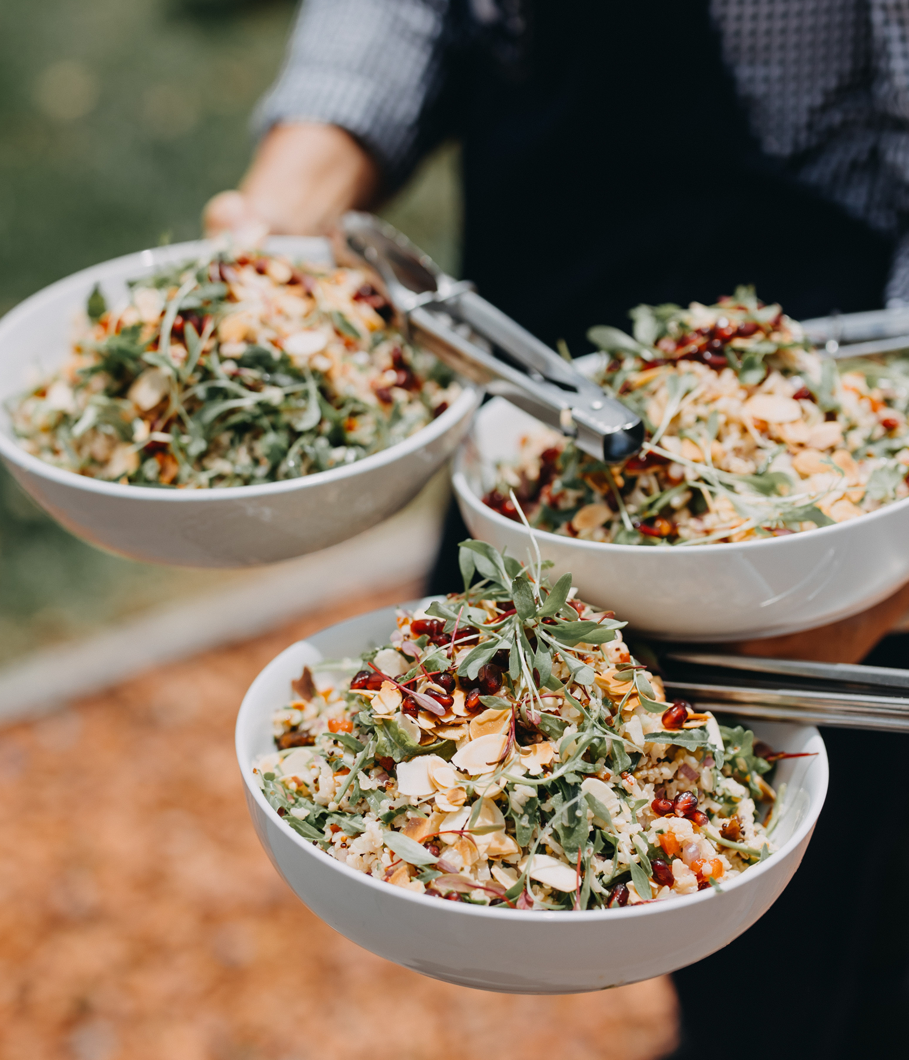 Brown rice, quinoa, rocket and pomegranates with toasted almonds