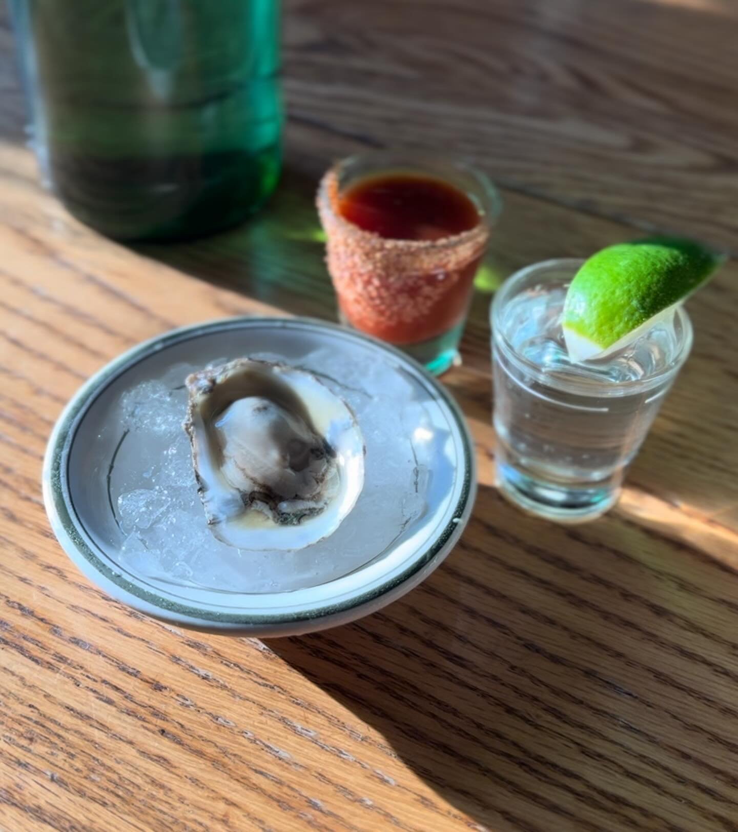 Oyster shooters with tequila, housemade sangrita and chili salt
