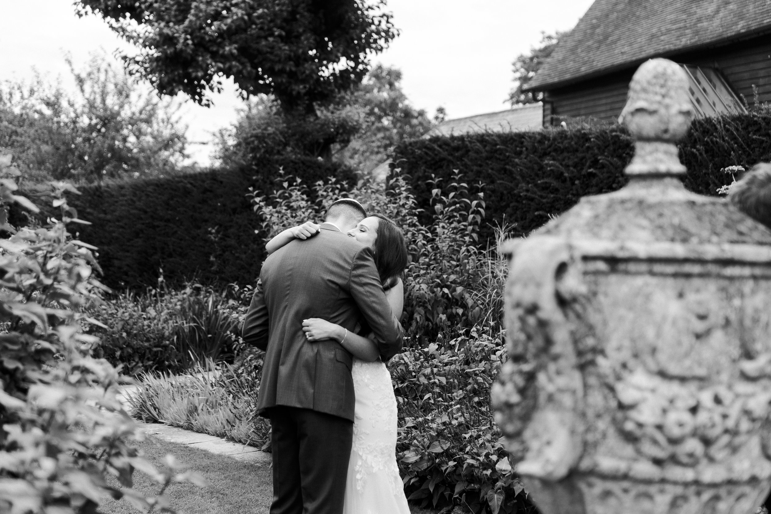 Couple hugging after their First Look at a Micklefield Hall Wedding