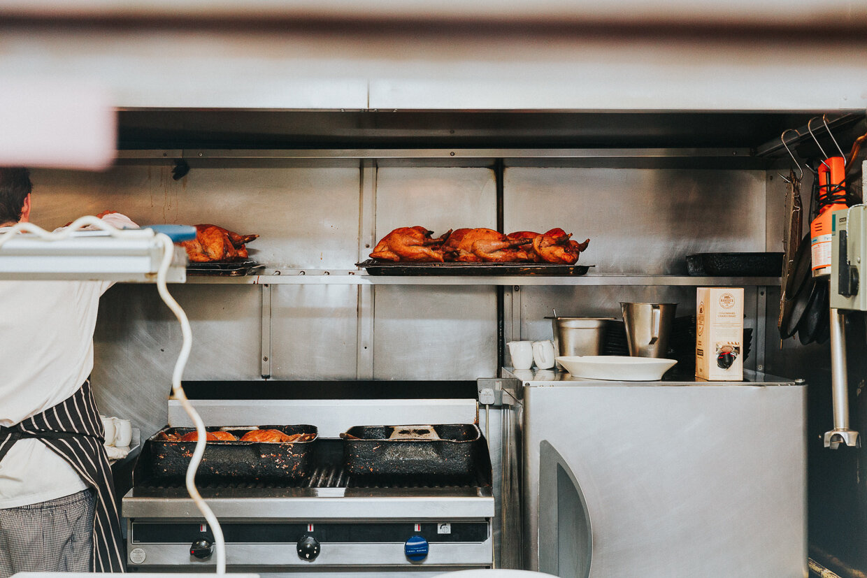 View of the kitchen where the chef is preparing whole chickens at St Johns Restaurant, Smithfield for a City of London Wedding
