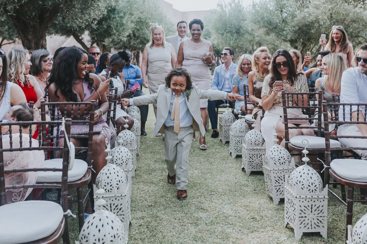 Young Groom-men walking down the aisle at Le Palais Paysan, Marrakech, Morocco