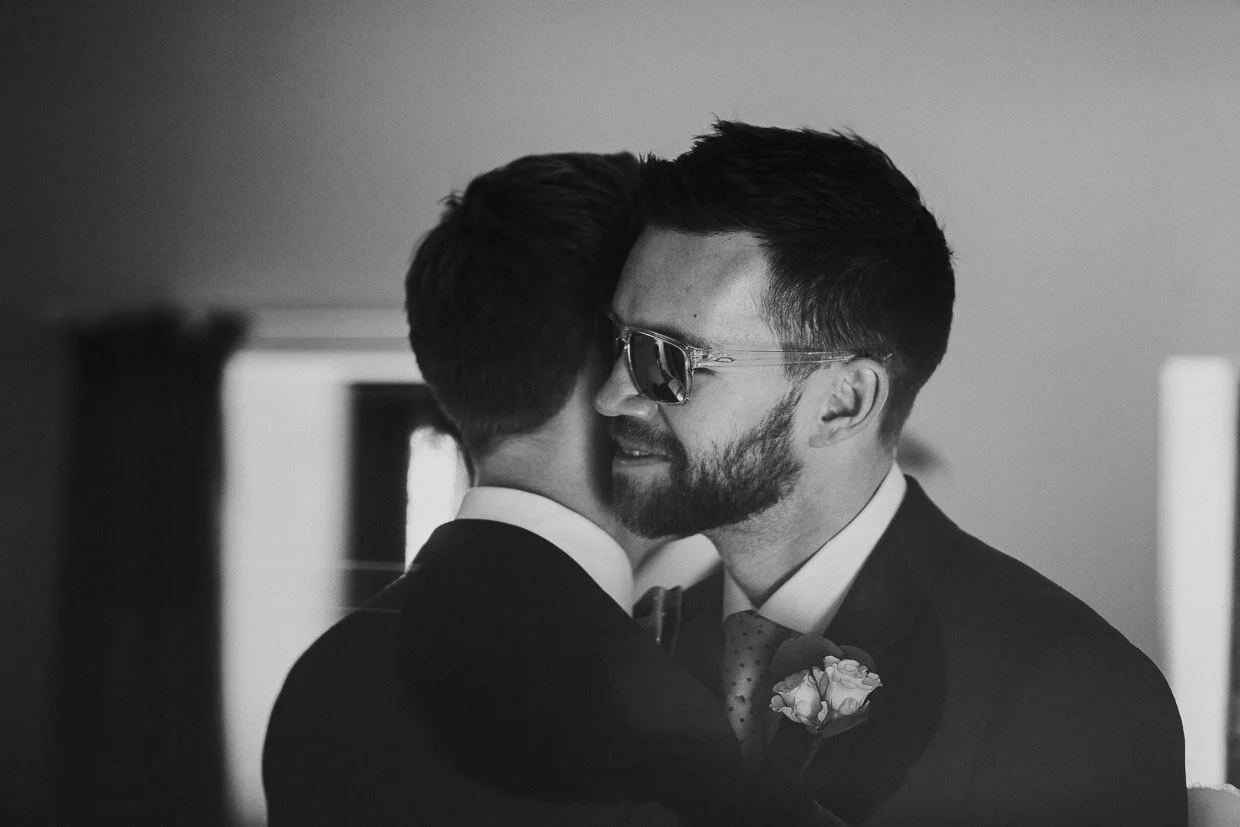 Groom & Groomsmen hugging on the Ballynatray Estate for a Cork Wedding