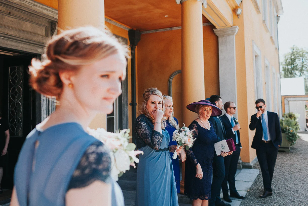 bridemaids with guests standing at the front of the house on the Ballynatray Estate for a Cork Wedding