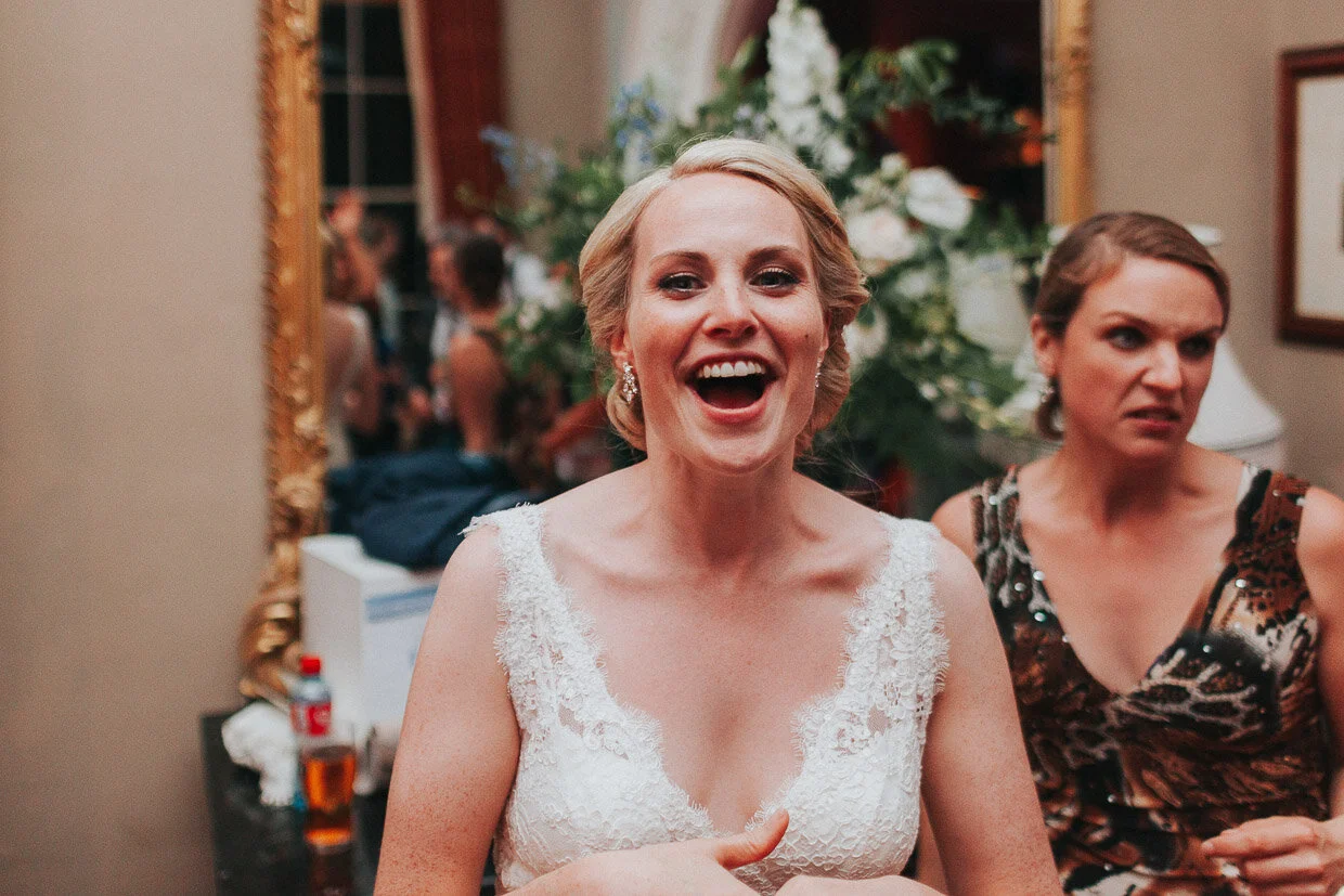 Bride on the dancefloor smiling at the camera Wedding couple dancing, facing each other for their first dance in between spotlights on the Ballynatray Estate for a Cork Wedding