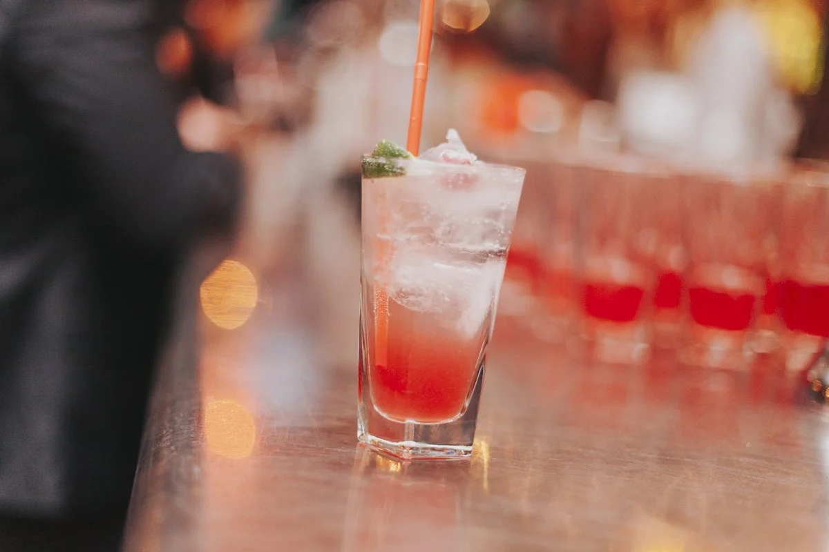 A cocktail sitting on the bar at the iconic The Old Queens Head, Essex Road, Islington for a London Wedding