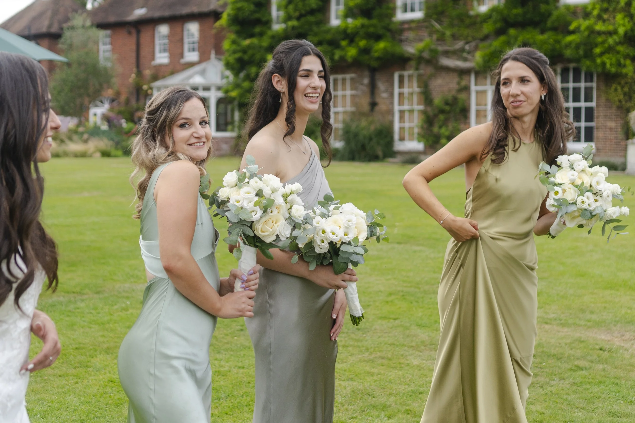 Bridemaids posing for the camera at the drinks reception at a Micklefield Hall Wedding